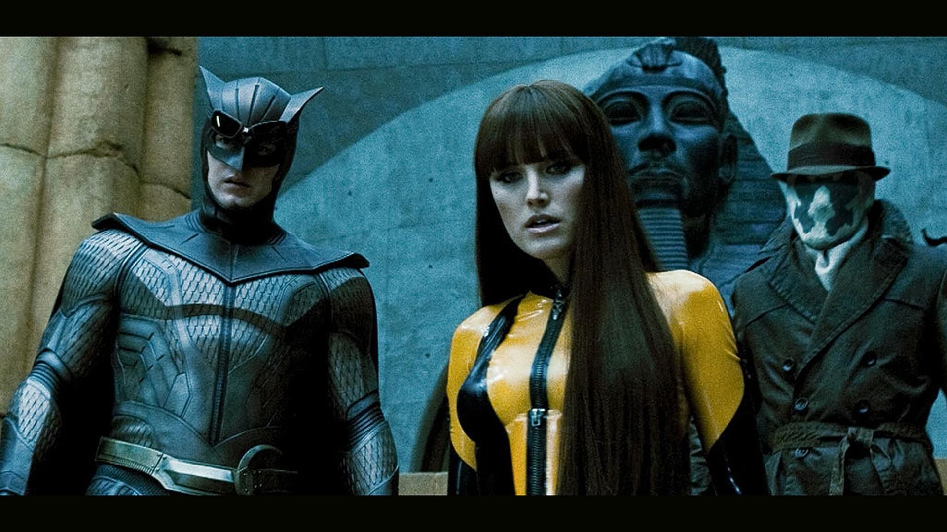 Screenshot from Watchmen featuring Nite Owl, Silk Spectre and Rorschach.