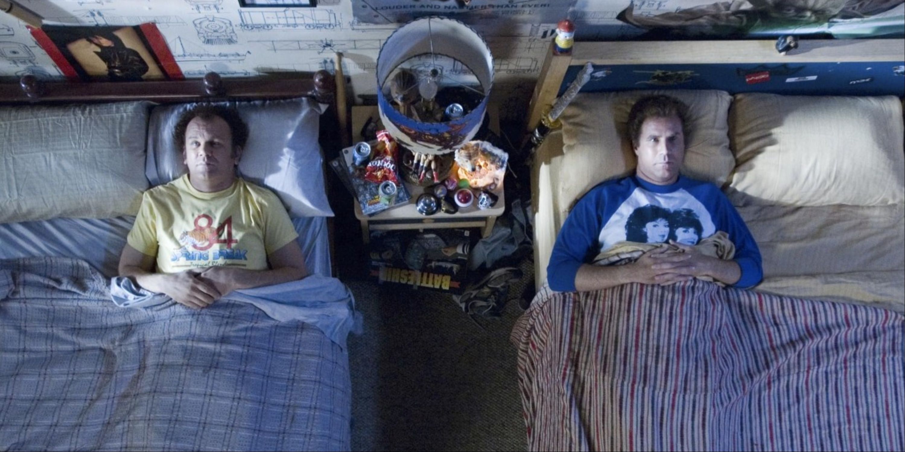 Dale and Brennan tucked in each other&rsquo;s separate beds and looking up at the ceiling as they talk in Step Brothers.