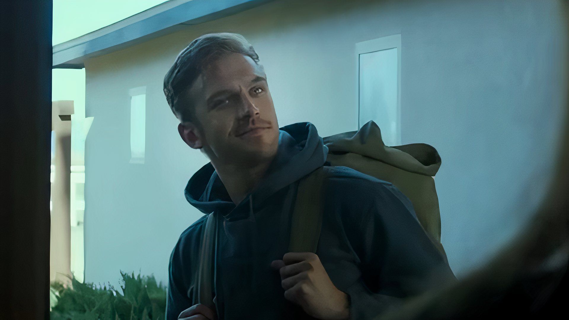 David Collins arrives at the Peterson house in The Guest.