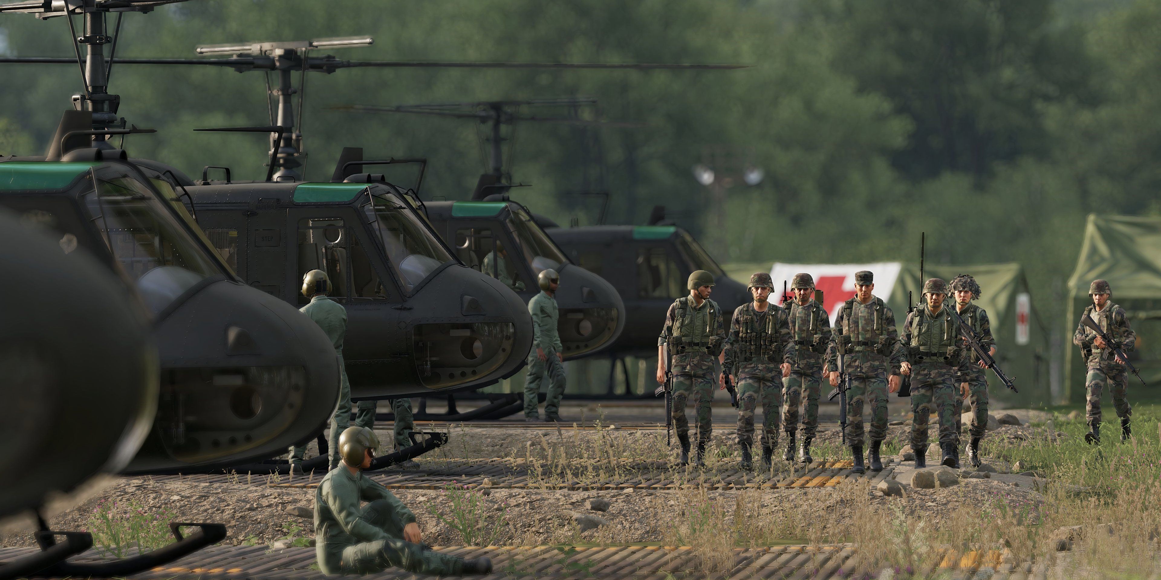 Soldiers walk in front of Helicopters in Arma Reforger.