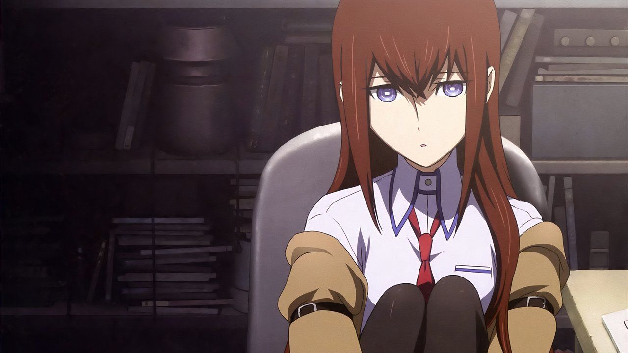 Koriso sits in a chair while looking sad at the Steins Gate.