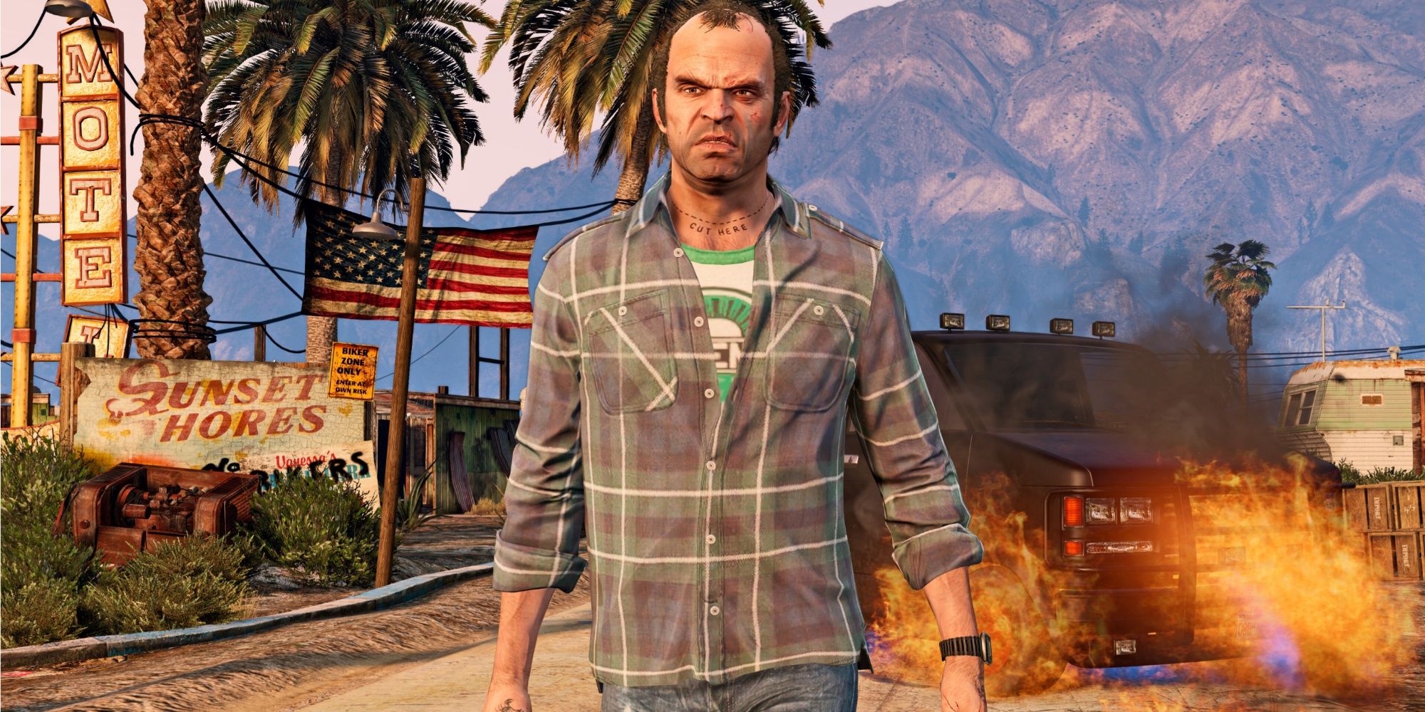 Trevor walking away from a burtning car in GTA 5 Enhanced. 