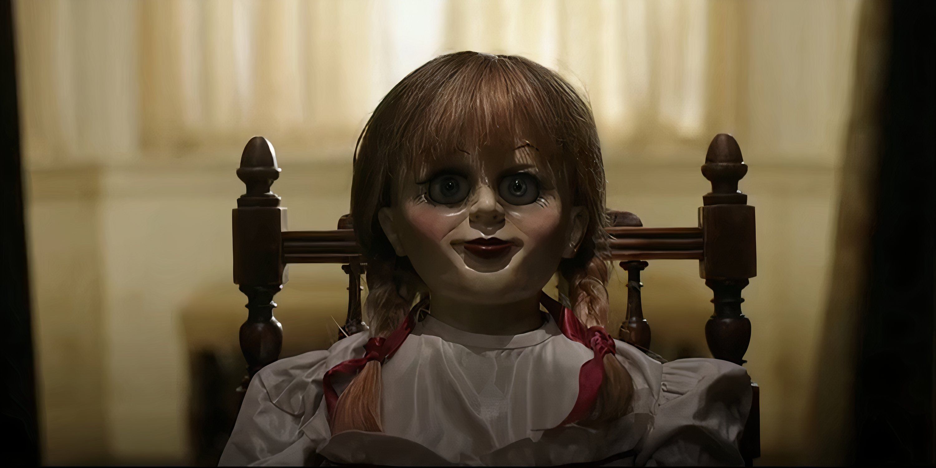 The Annabelle doll sits in its chair in Annabelle.