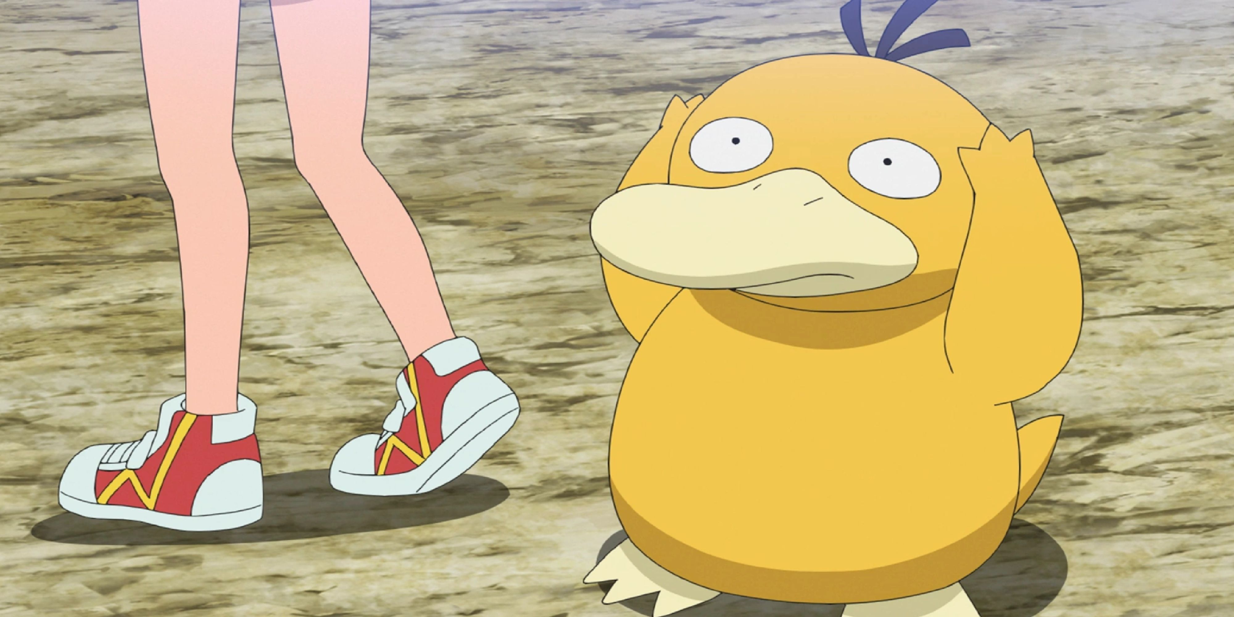 Psyduck grabbing its head with both arms in the Pokemon anime.