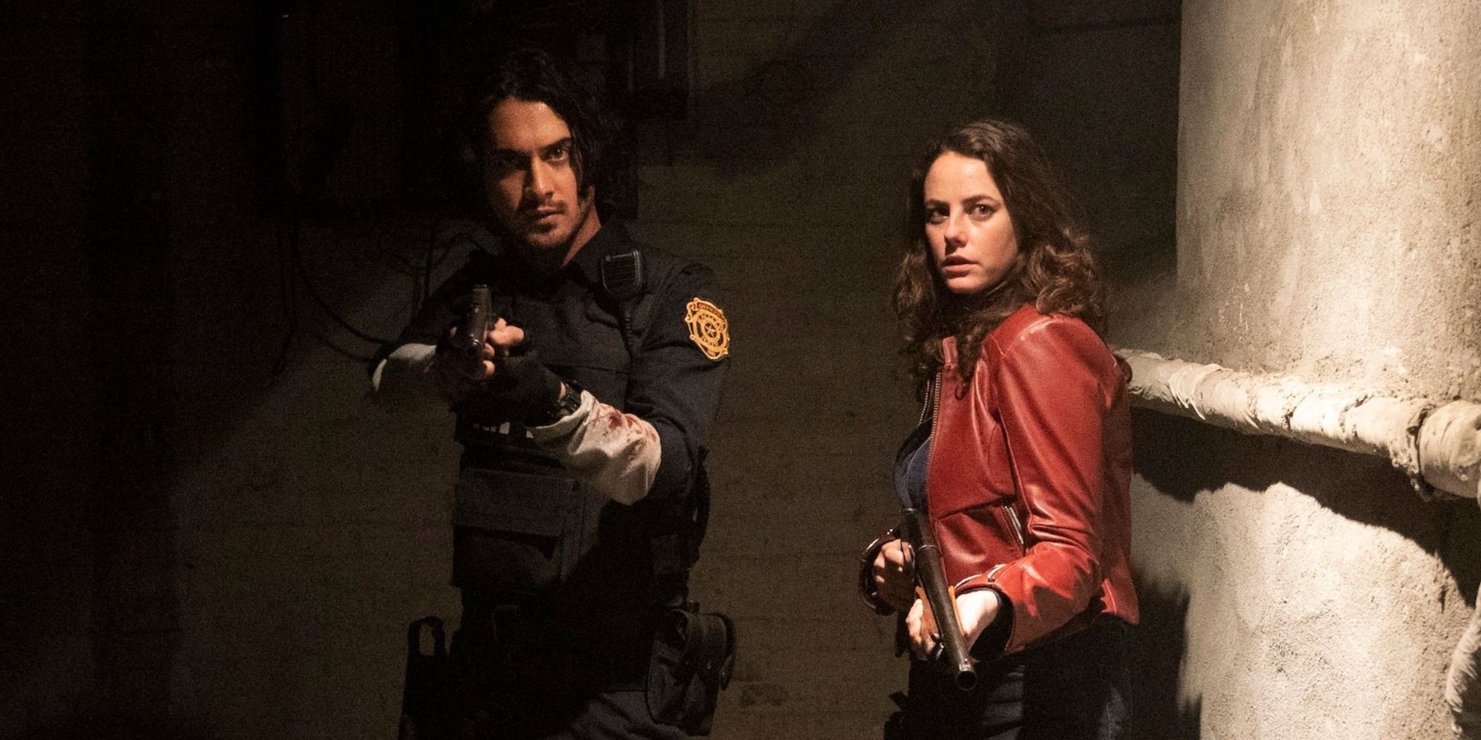 Leon and Claire holding guns in Resident Evil: Welcome to Raccoon City.