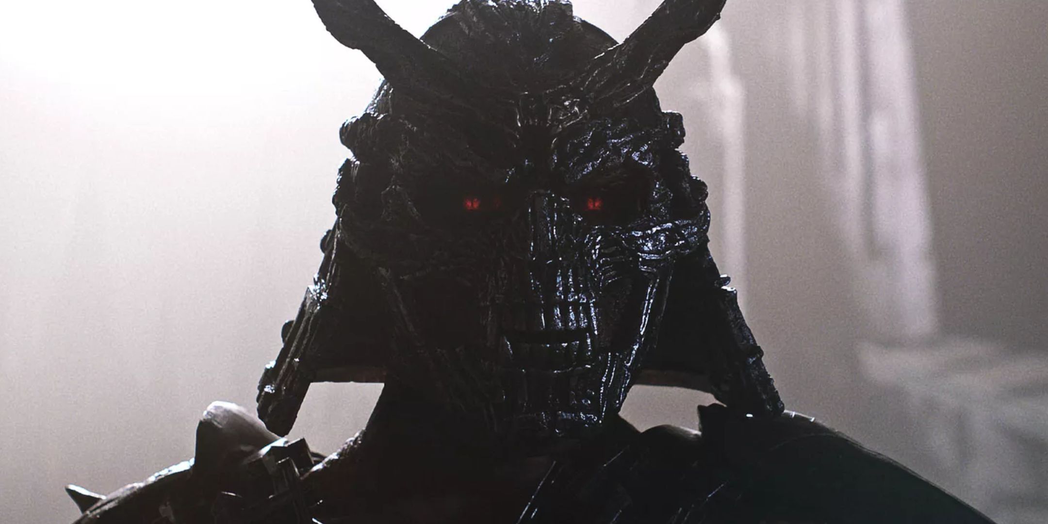 Shao Kahn in the Mortal Kombat 2 movie. His face is completely hidden under a helmet and he has glowing red eyes