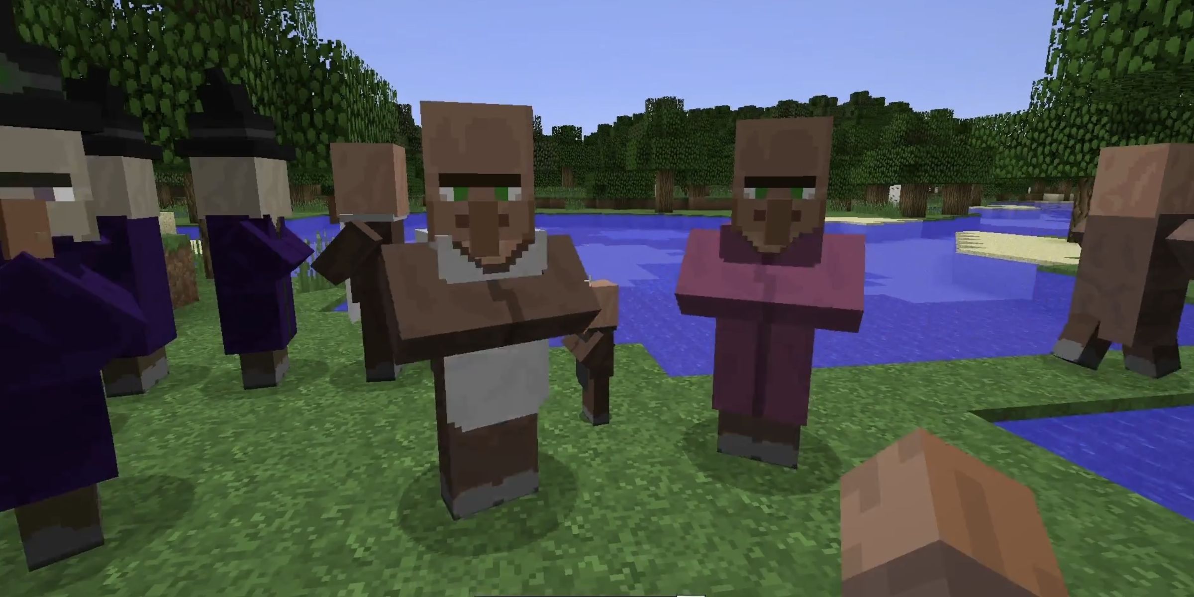 A player in the village skin around a group of sorcerers and villagers in the April Fools update of Mine Craft.