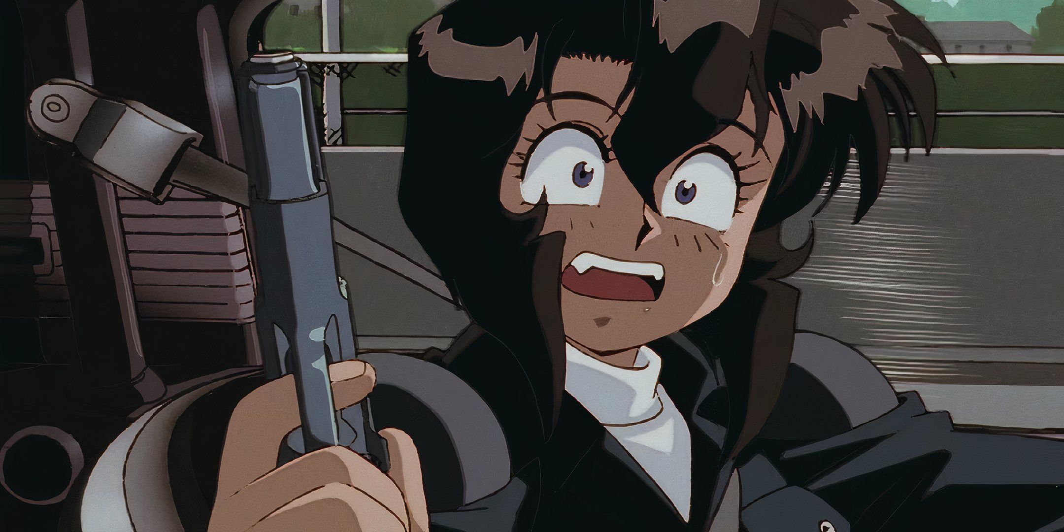 A still image from Gunsmith Cats, showing the main character looking surprised while holding a pistol.