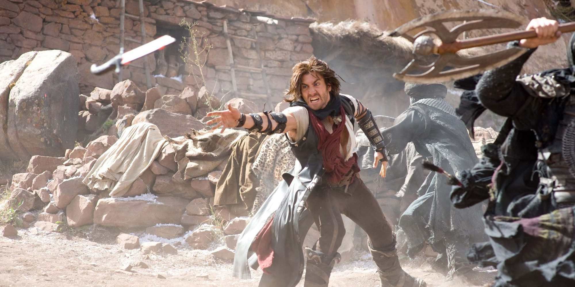 Dastan reaching for a sword in Prince Of Persia: The Sands Of Time Movie.