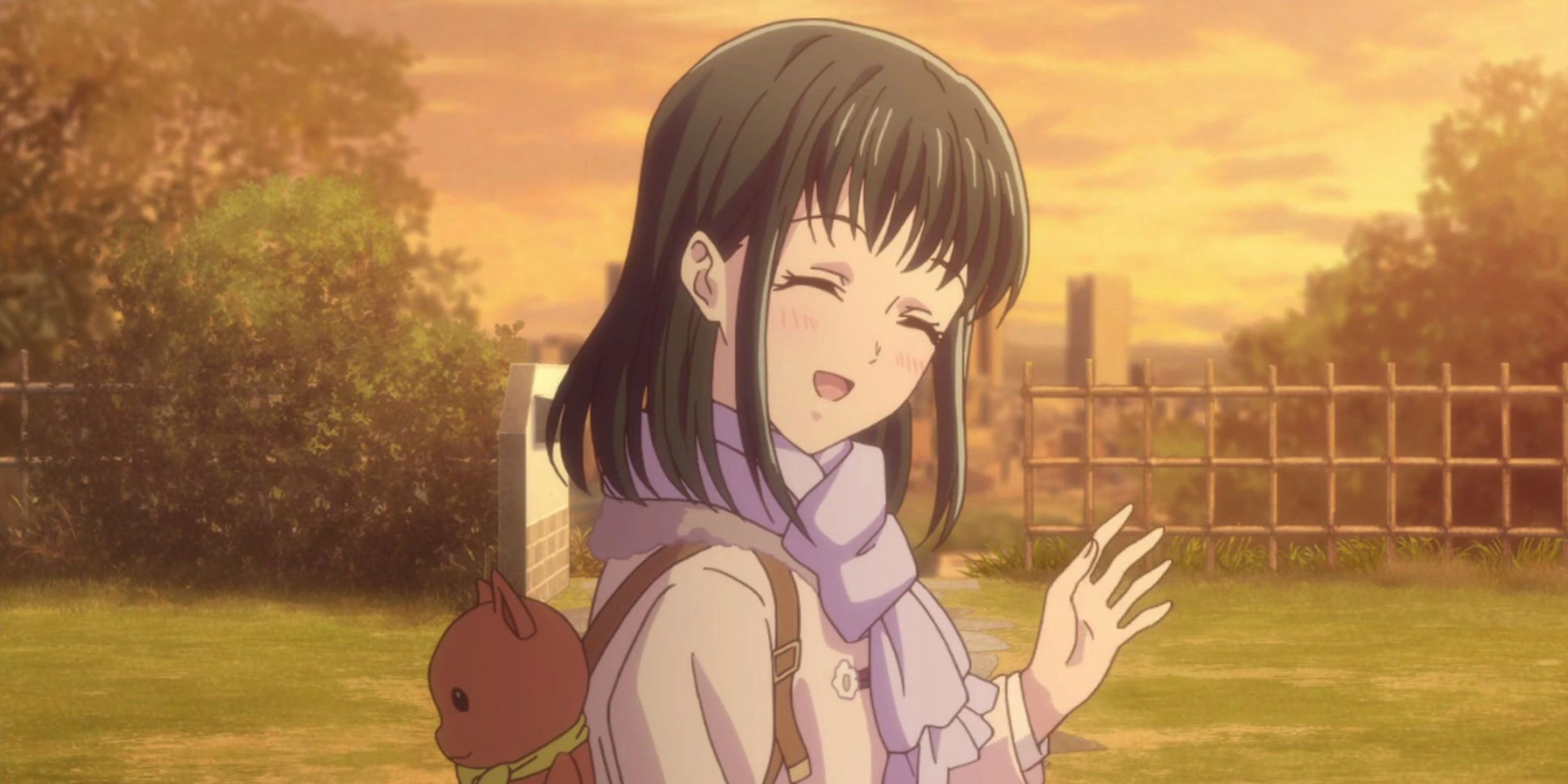 Kagora smiling at the fruit basket. 