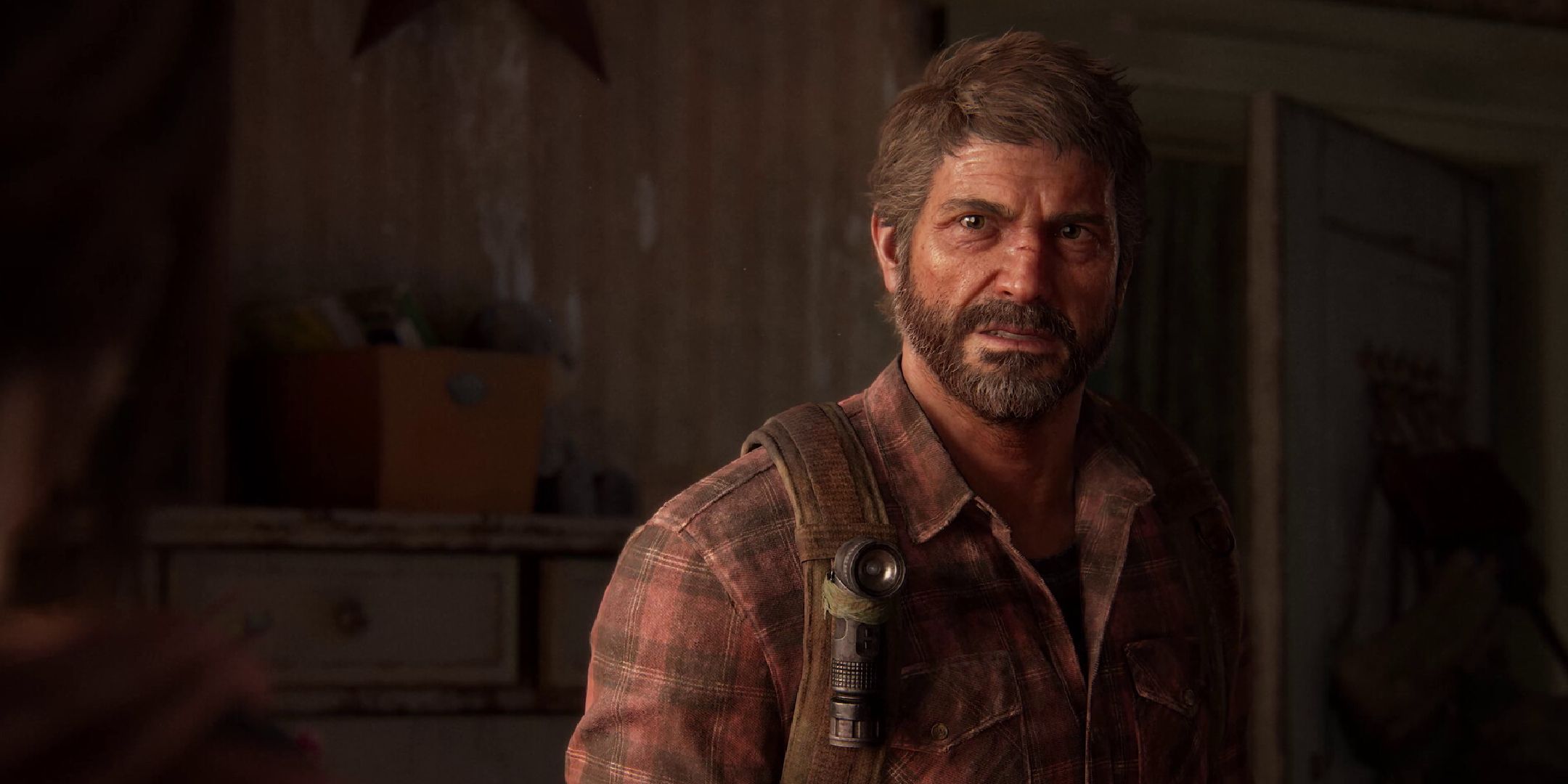 A close up of Joel from The Last of Us.