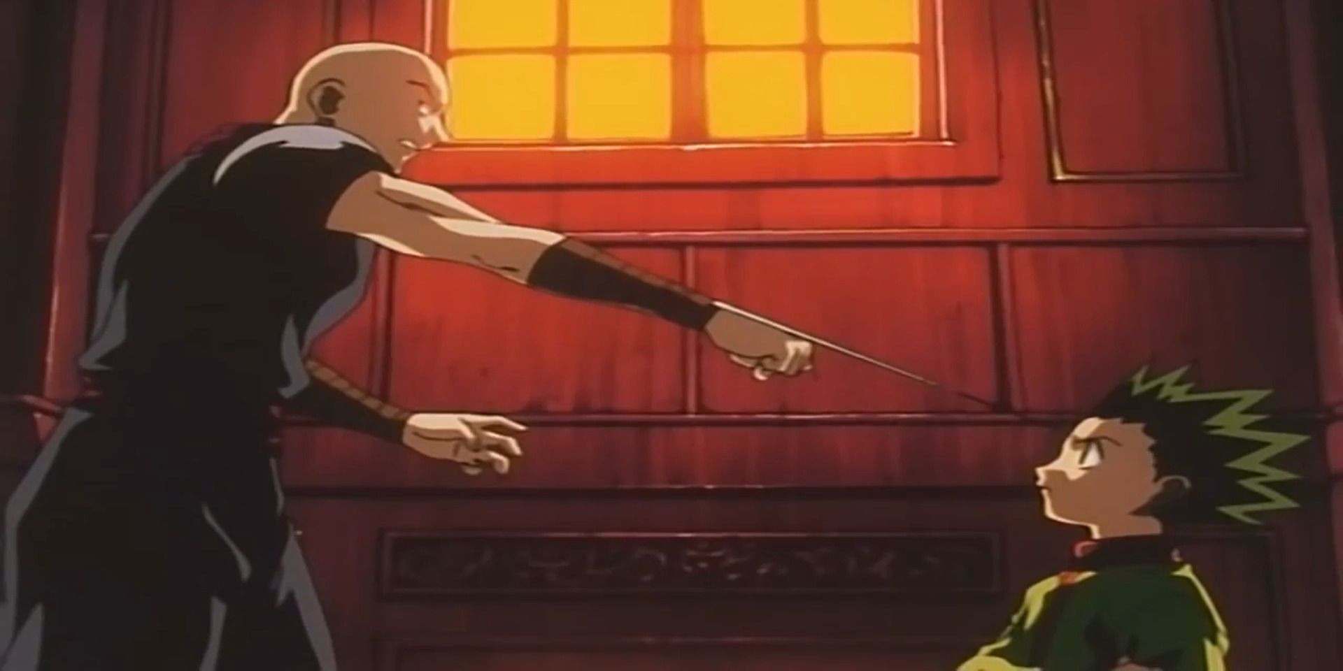 Hanzo Hunter is putting his blade on Gone's forehead in Hunter X Hunter (1999).