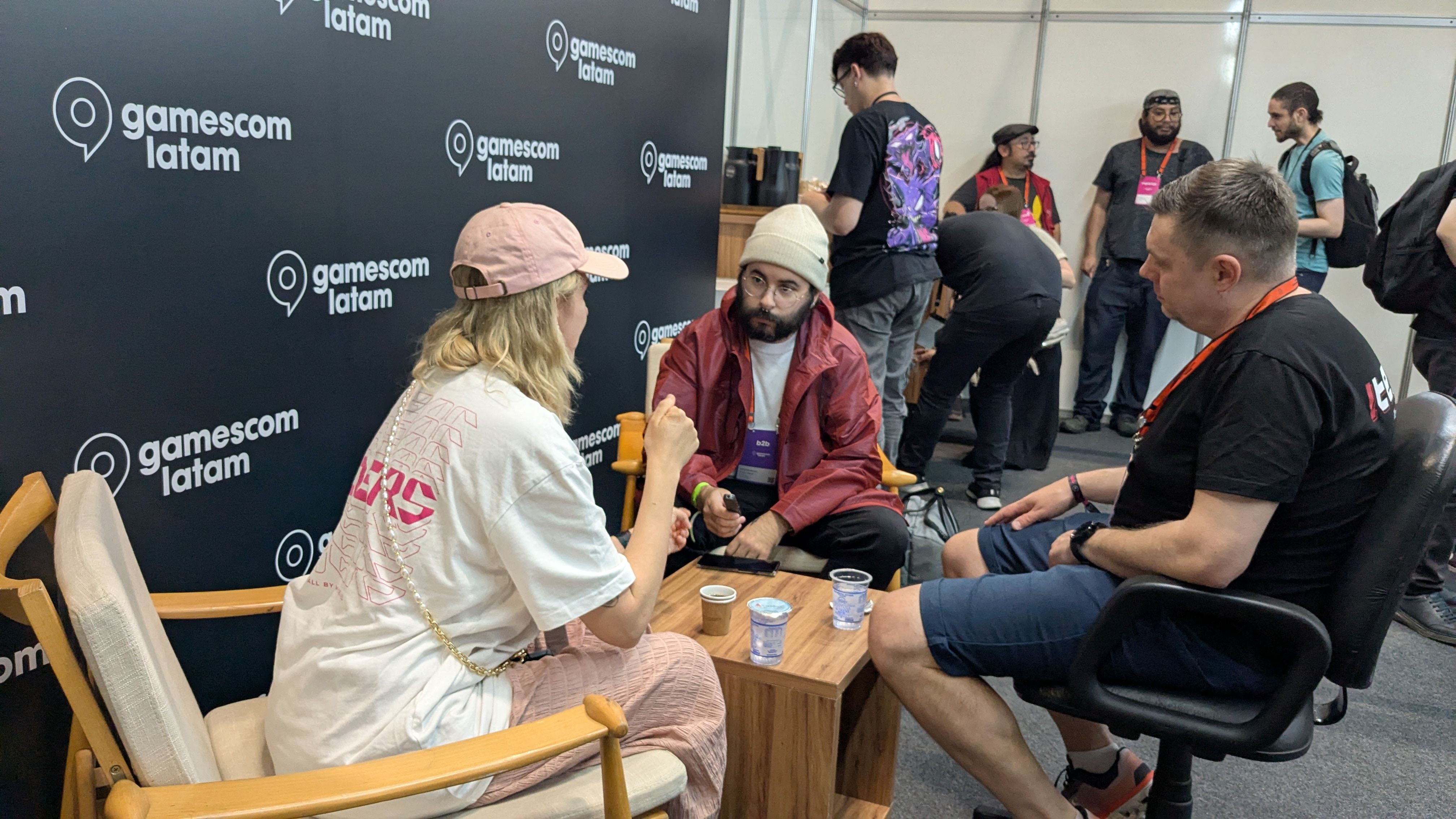 Gabriela and Konrad talking to Santi in Gamescom Latam