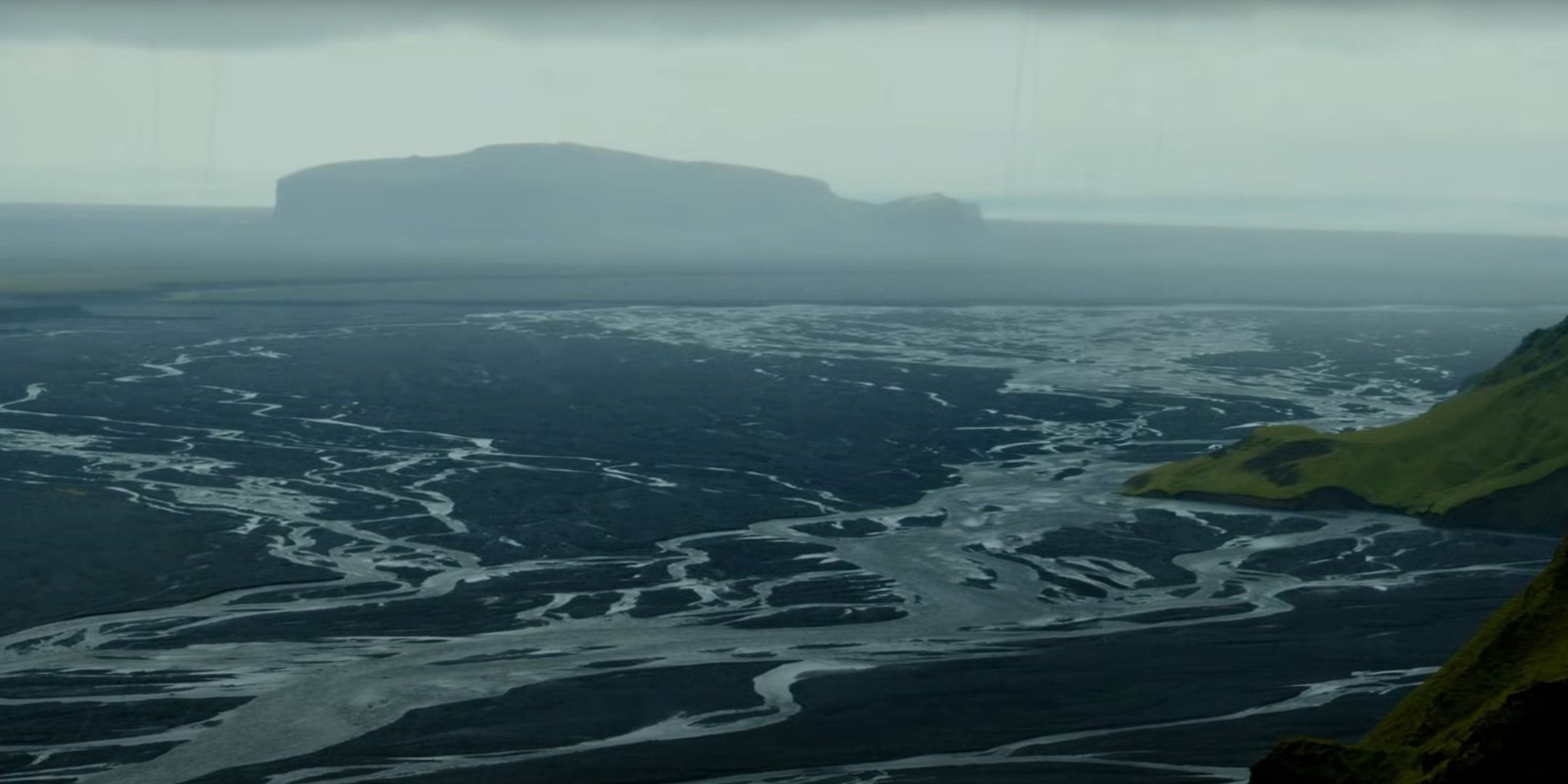Staring out at the expansive wasteland in Death Stranding.