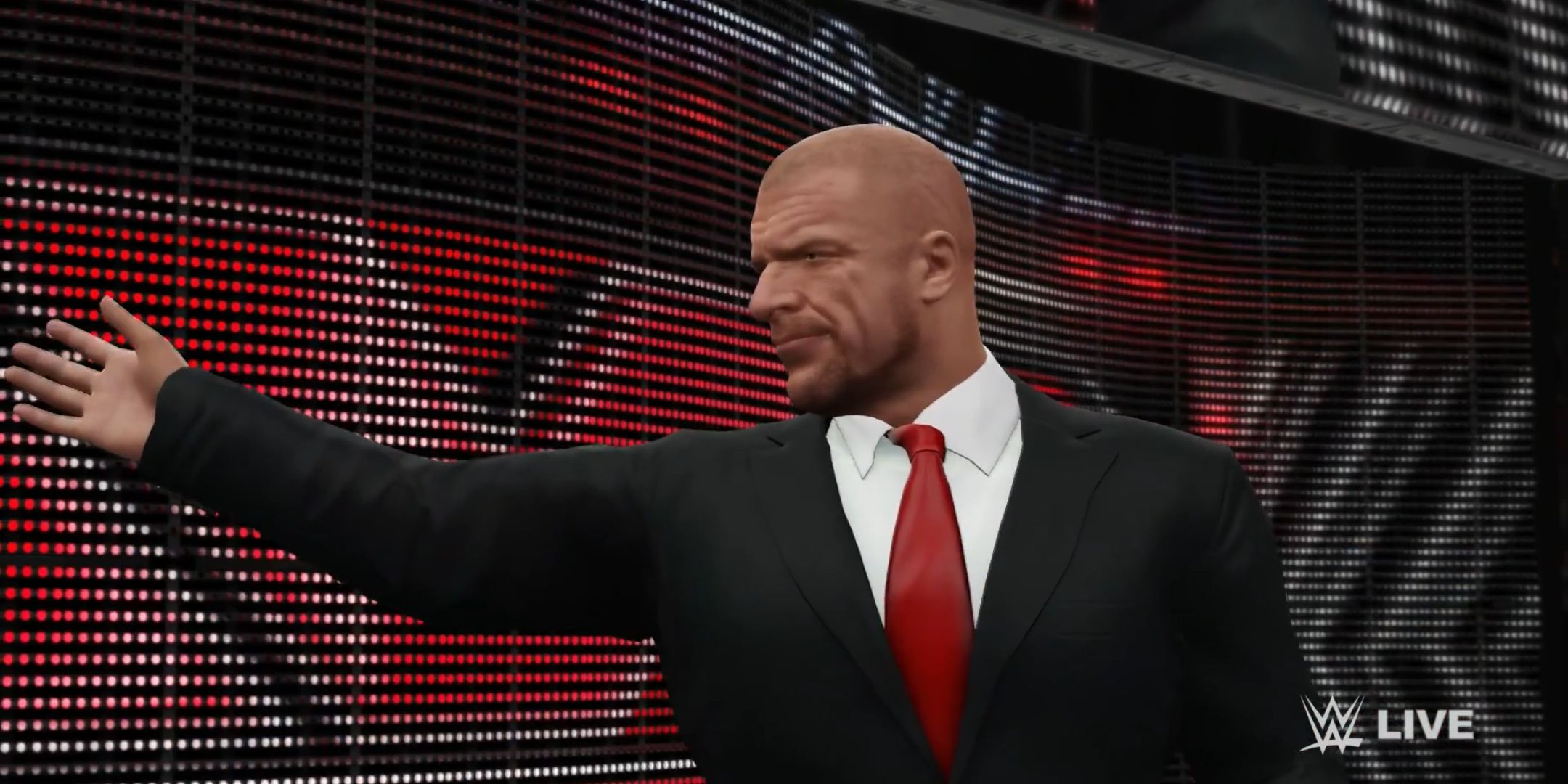 Triple H on stage with his arm out in WWE 2K16.