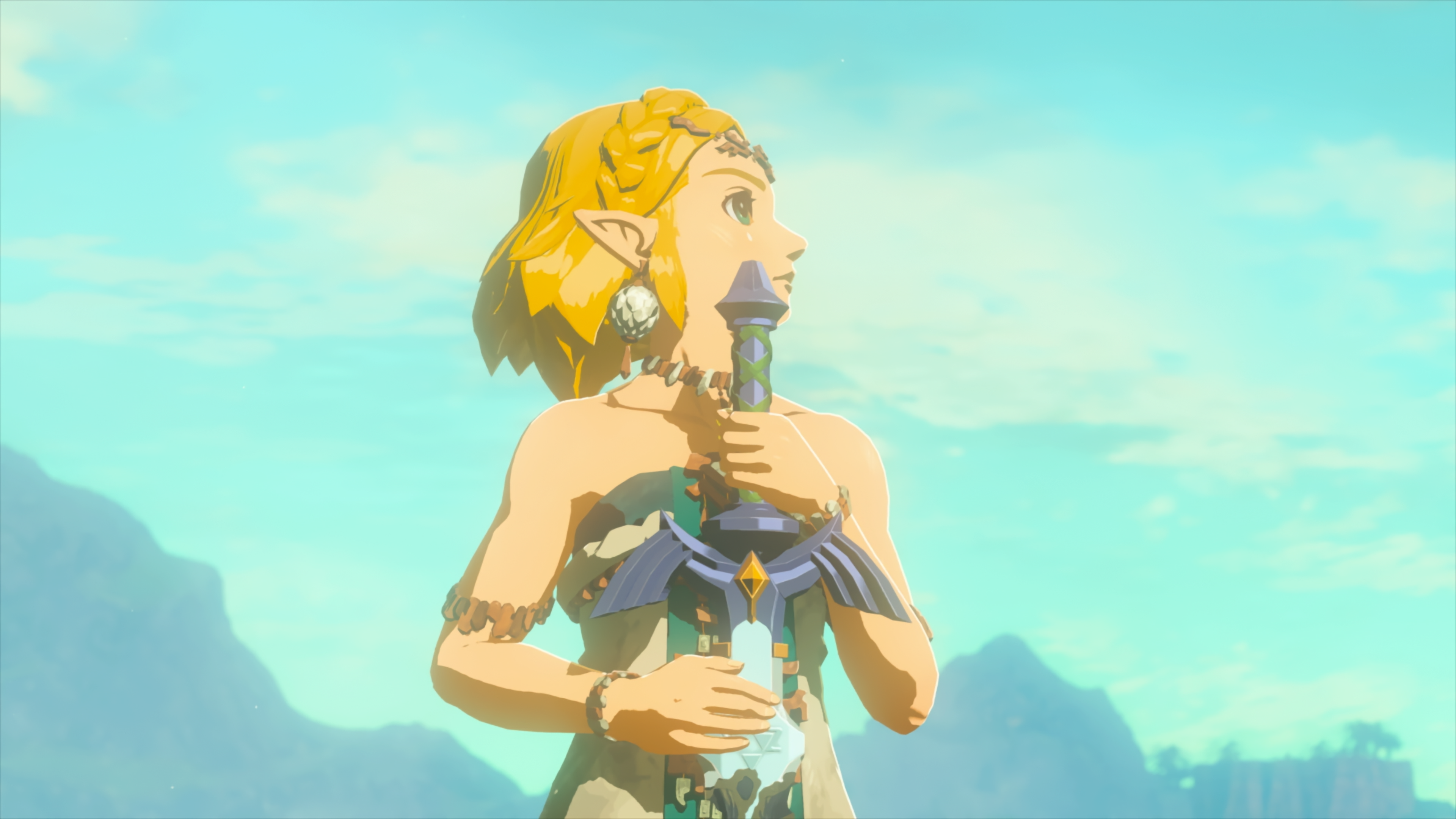 Zelda holds the master sword while looking out to the sky in Tears of the Kingdom.