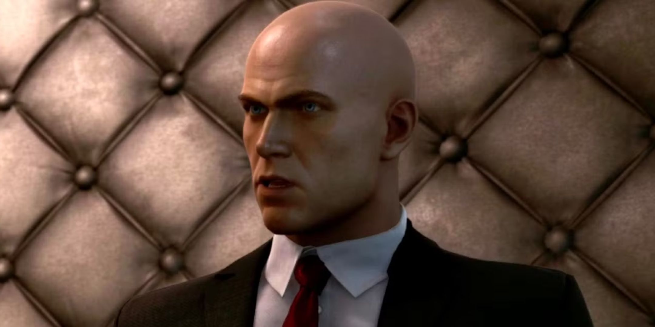 Agent 47 in a padded room in Hitman 3.