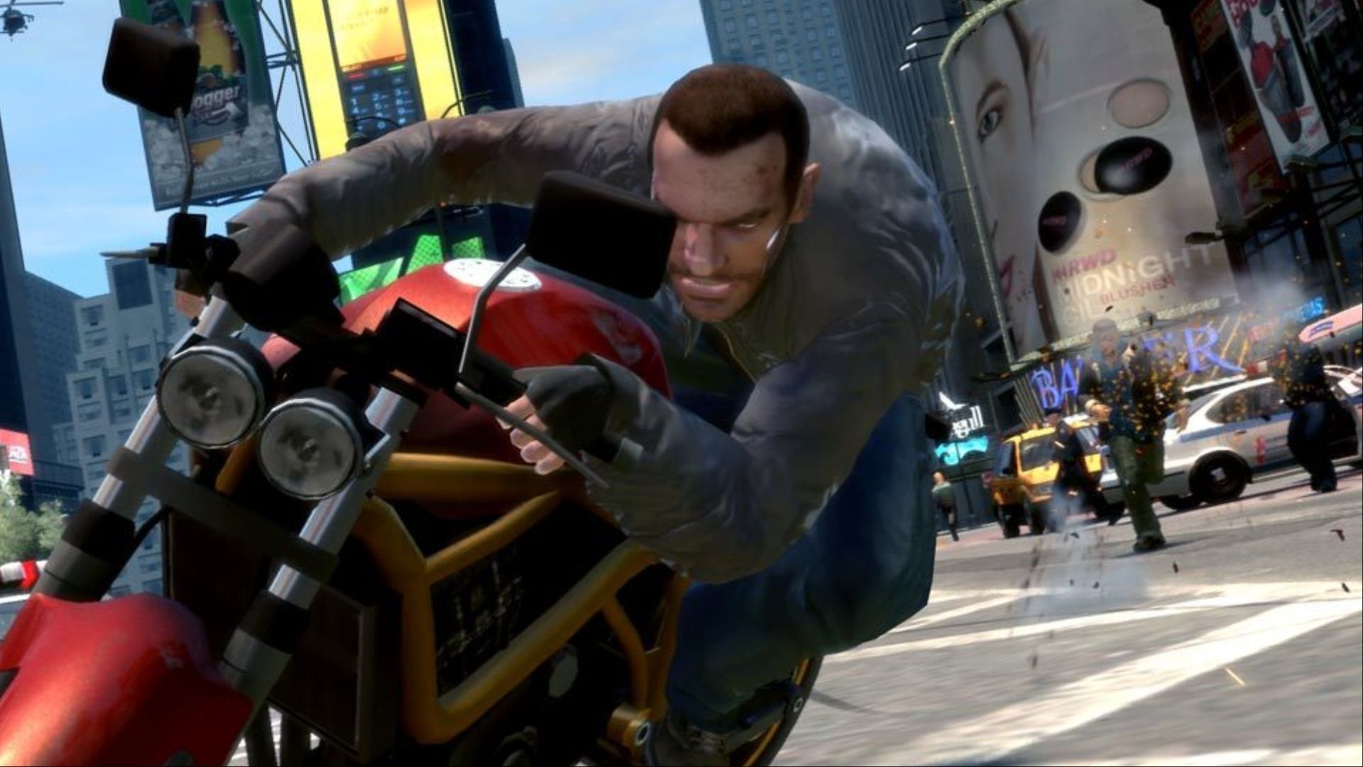 Niko Bellic riding through the streets of Liberty City on a motorcycle while being shot at by cops in Grand Theft Auto 4.