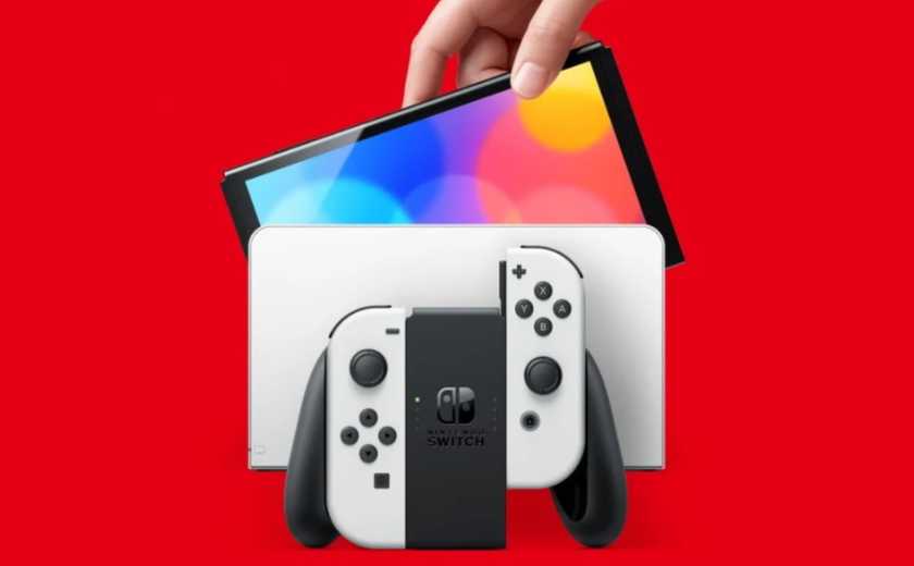 someone lifting the screen out of an oled switch dock.