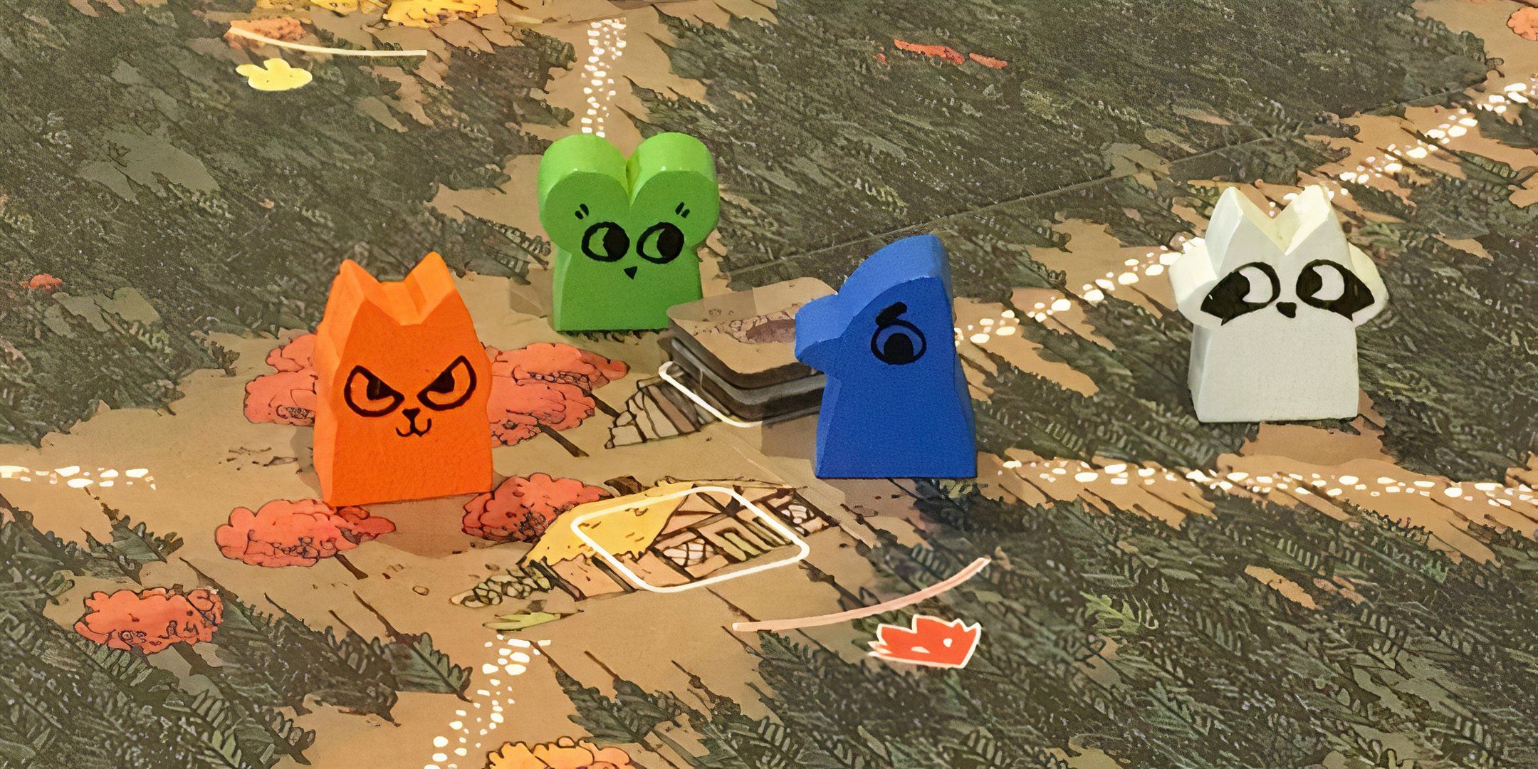 Four woodland meeples on the Root board game map.