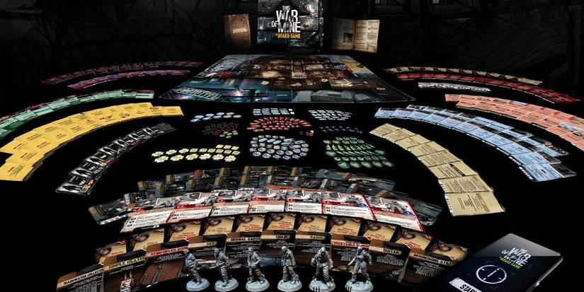 All the The War of Mine board game pieces laid out.