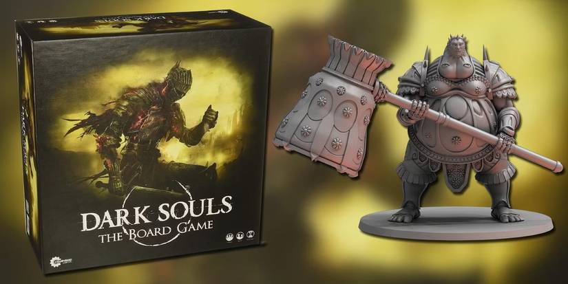 Dark Souls board game box standing next to the Executioner Smaug miniature.