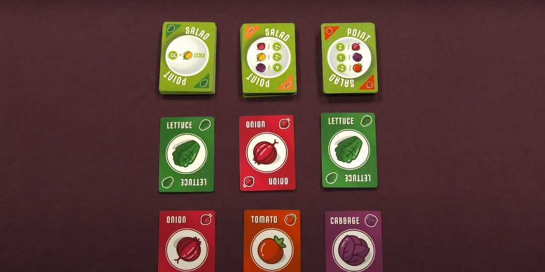 In the middle of a point salad table with several types of vegetables.