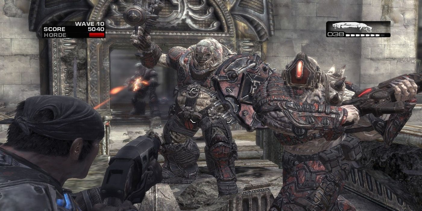 Gears of War player pointing a gun at two enemies.