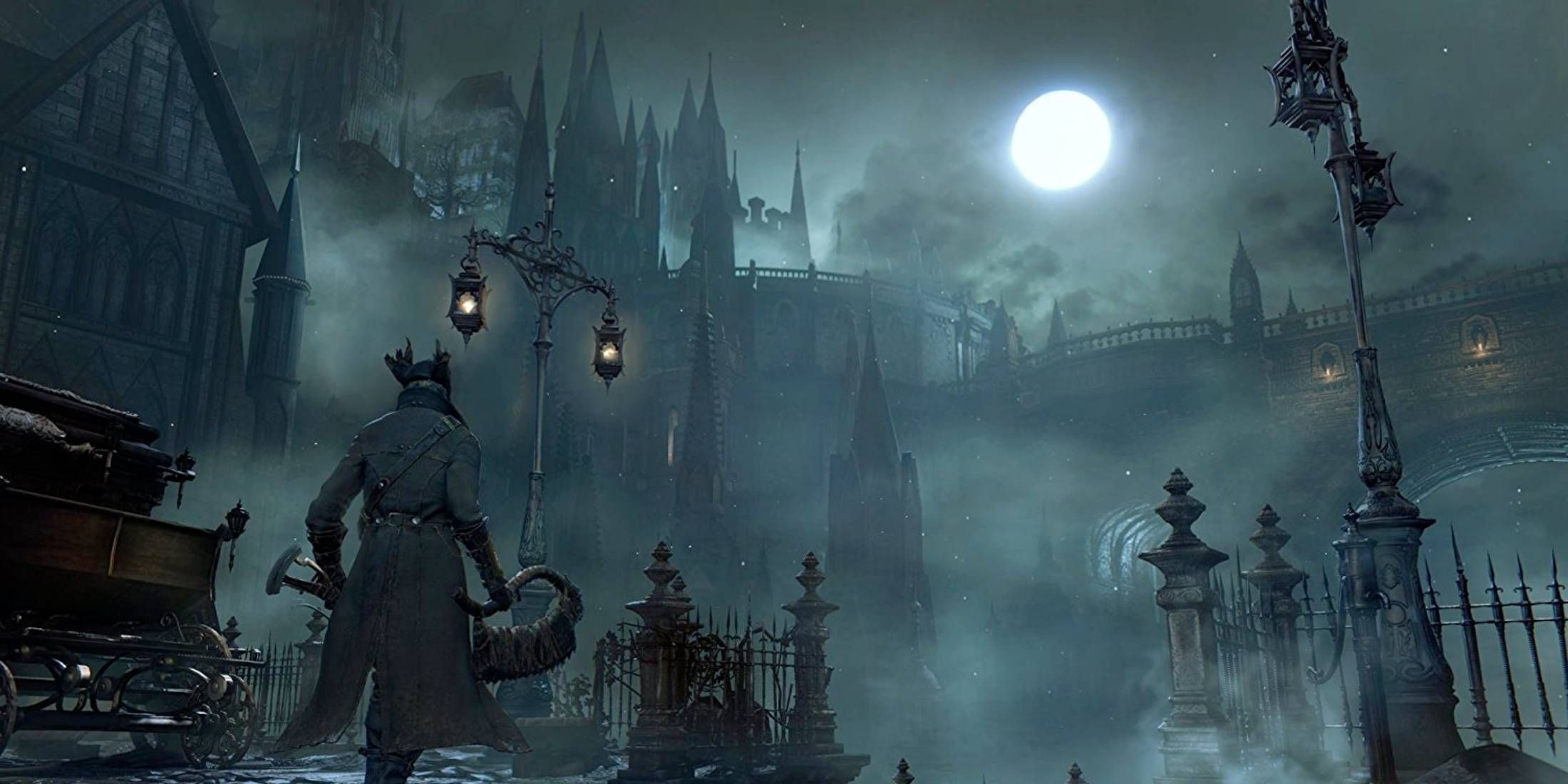 Main character in Bloodborne stands in front of a huge castle, while moonlight shines through the mist.