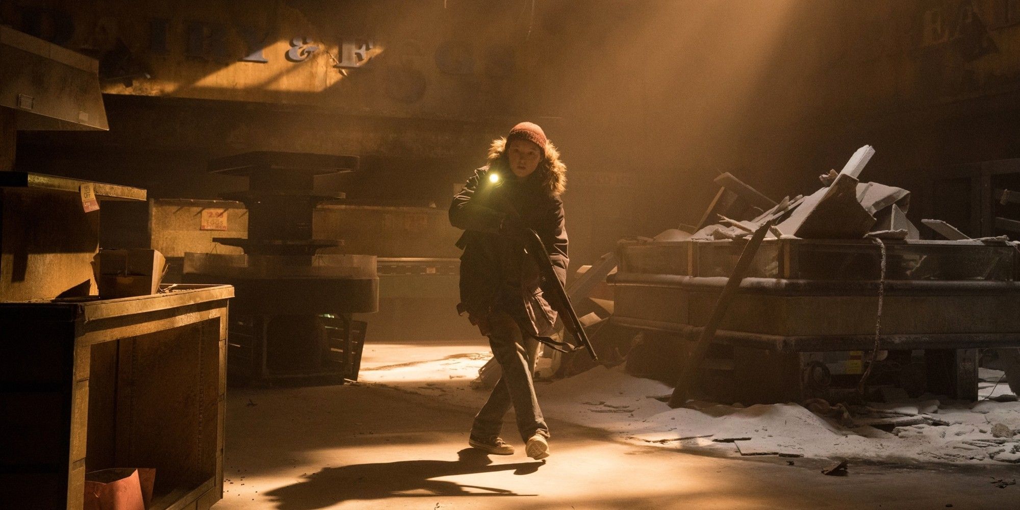 ellie-wanders-through-an-abandoned-building-with-a-gun-in-the-last-of-us-season-2.jpg