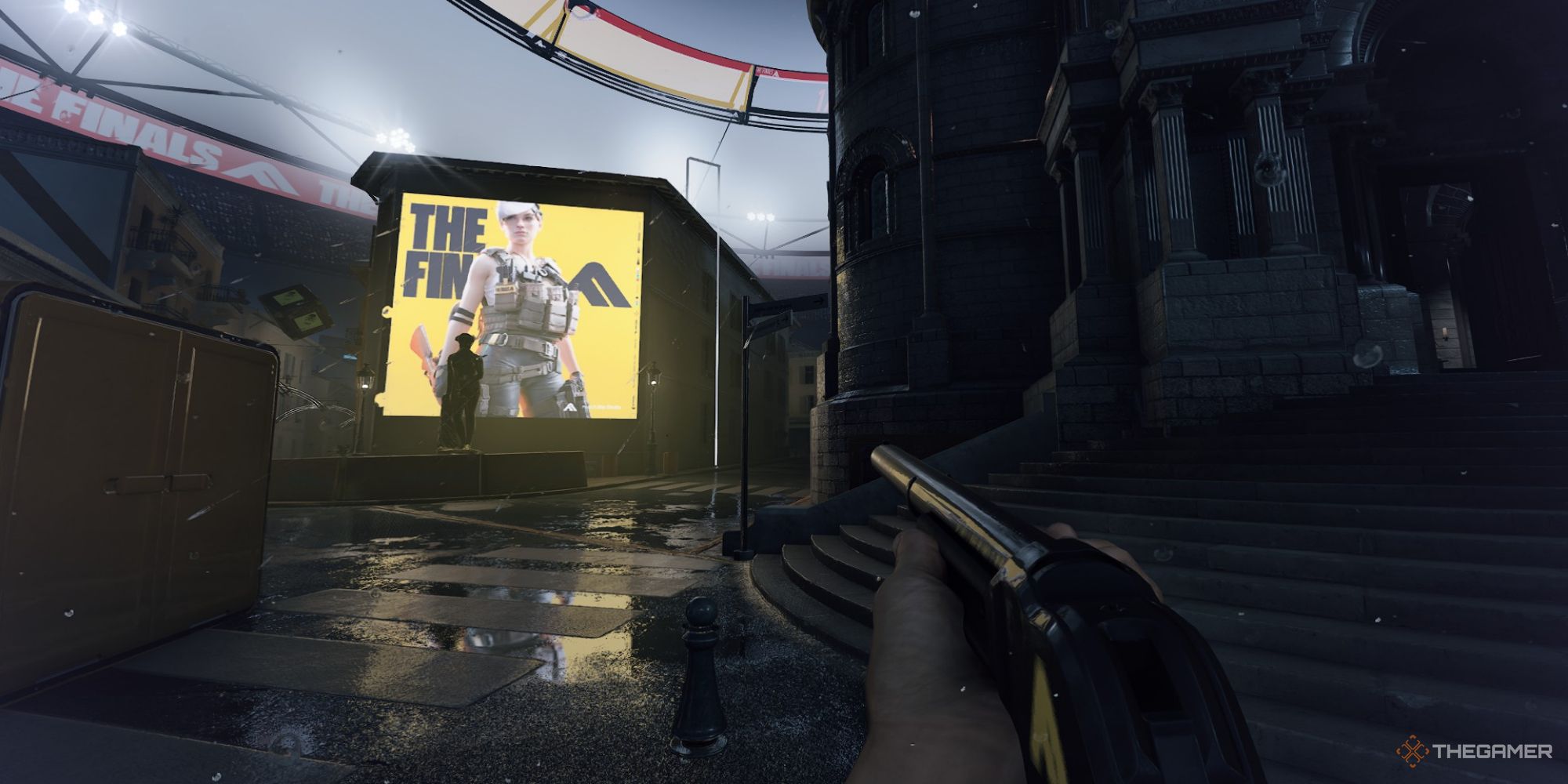A screenshot from The Finals showing a player character holding a shotgun in the rain. The Finals advertisement can be seen a short distance away on a digital screen.