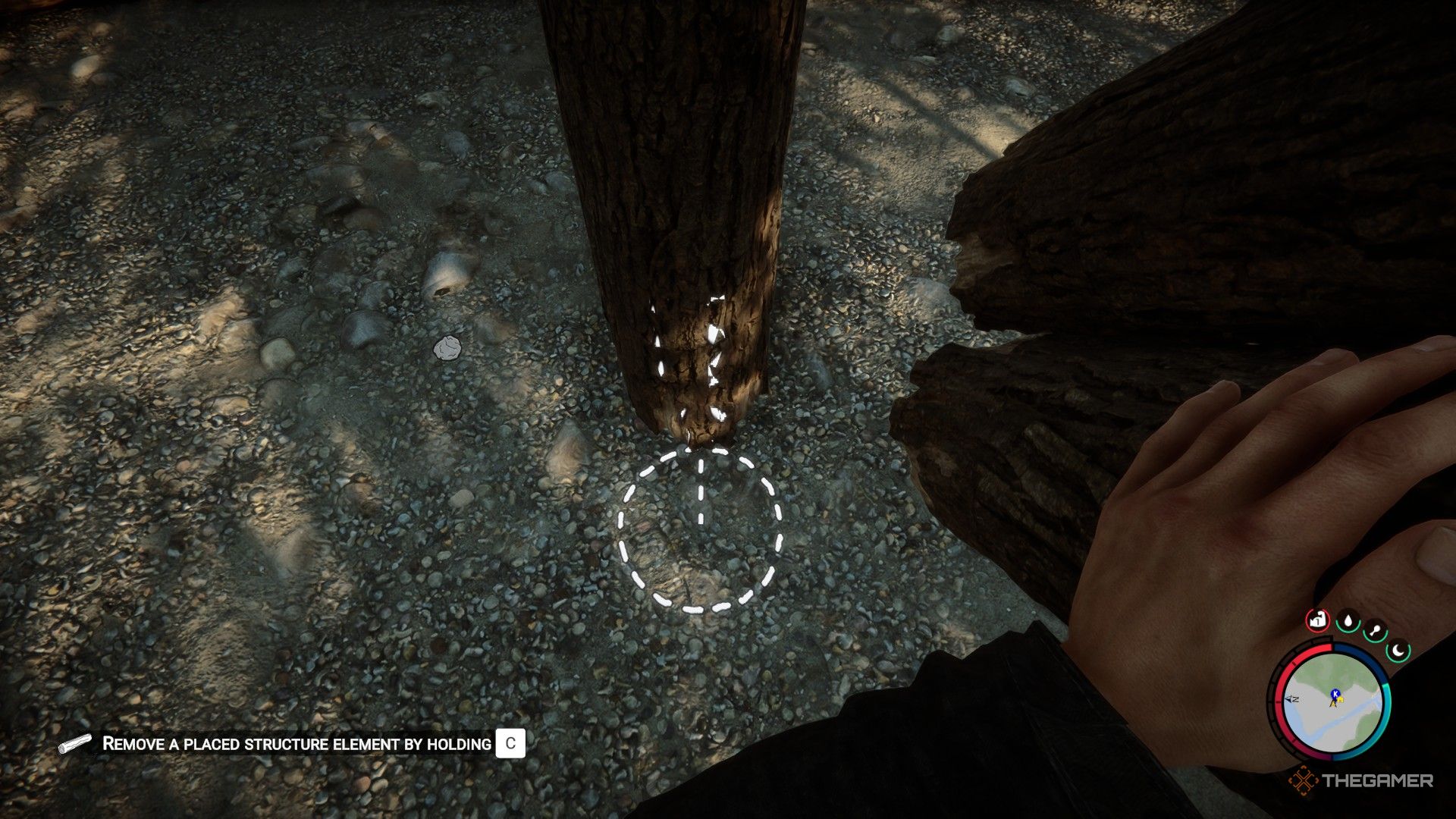 A screenshot from Sons of the Forest showing the player character holding two logs as a circle on the ground next to an upright one gives the prompt of a straight line placement.