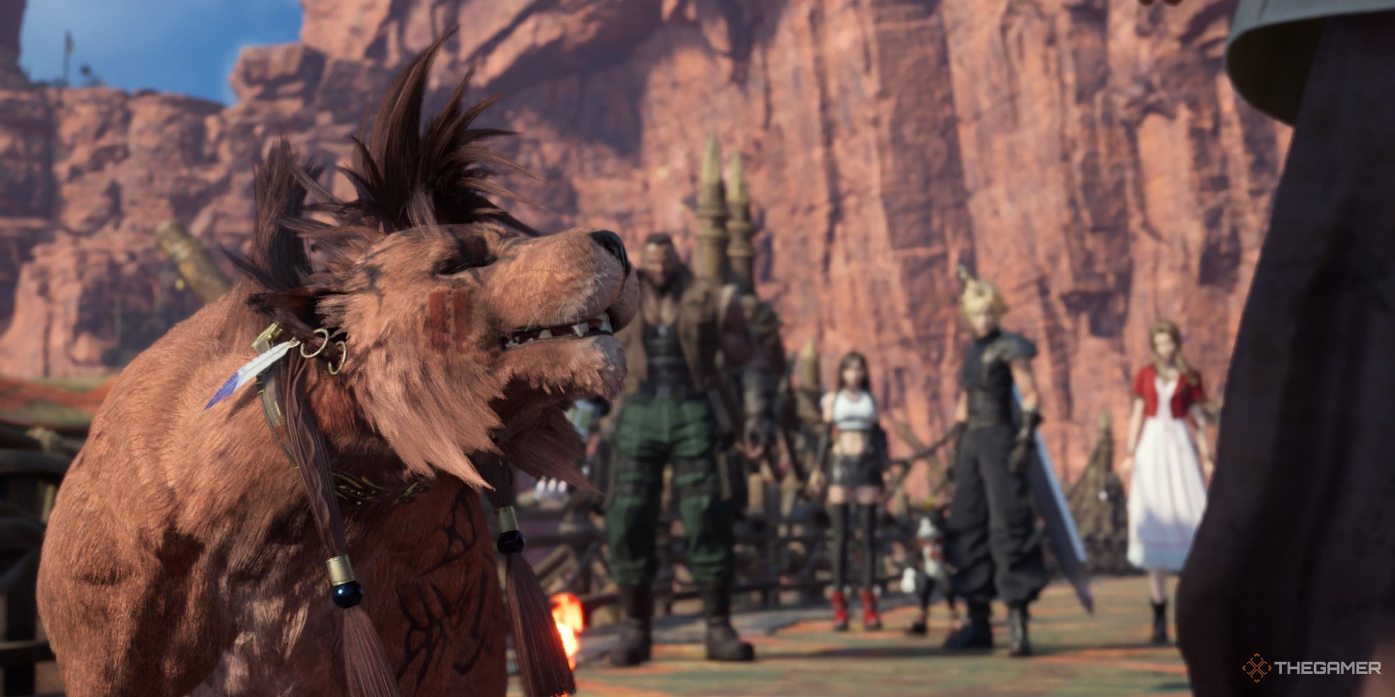 Red XIII looking up at friends at the front gate of Cosmo Canyon in Final Fantasy 7 Rebirth.