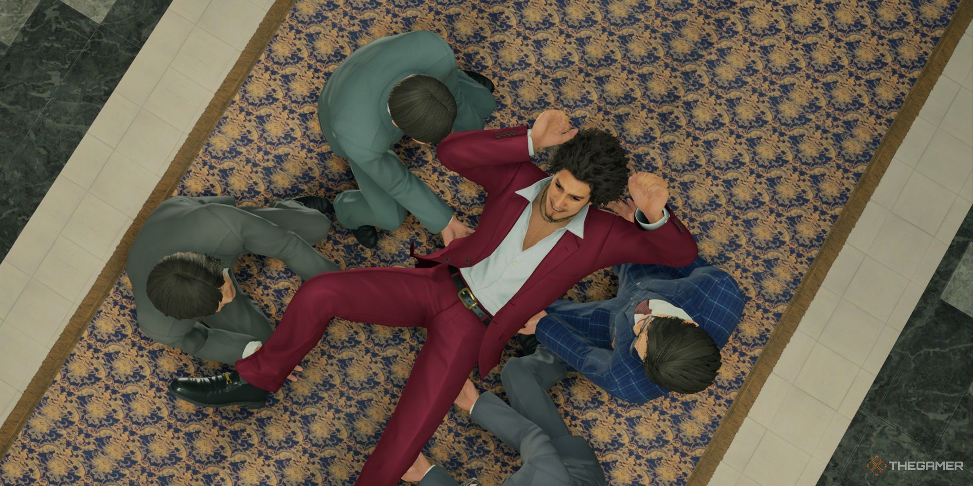 ichiban being carried from the floor in yakuza like a dragon