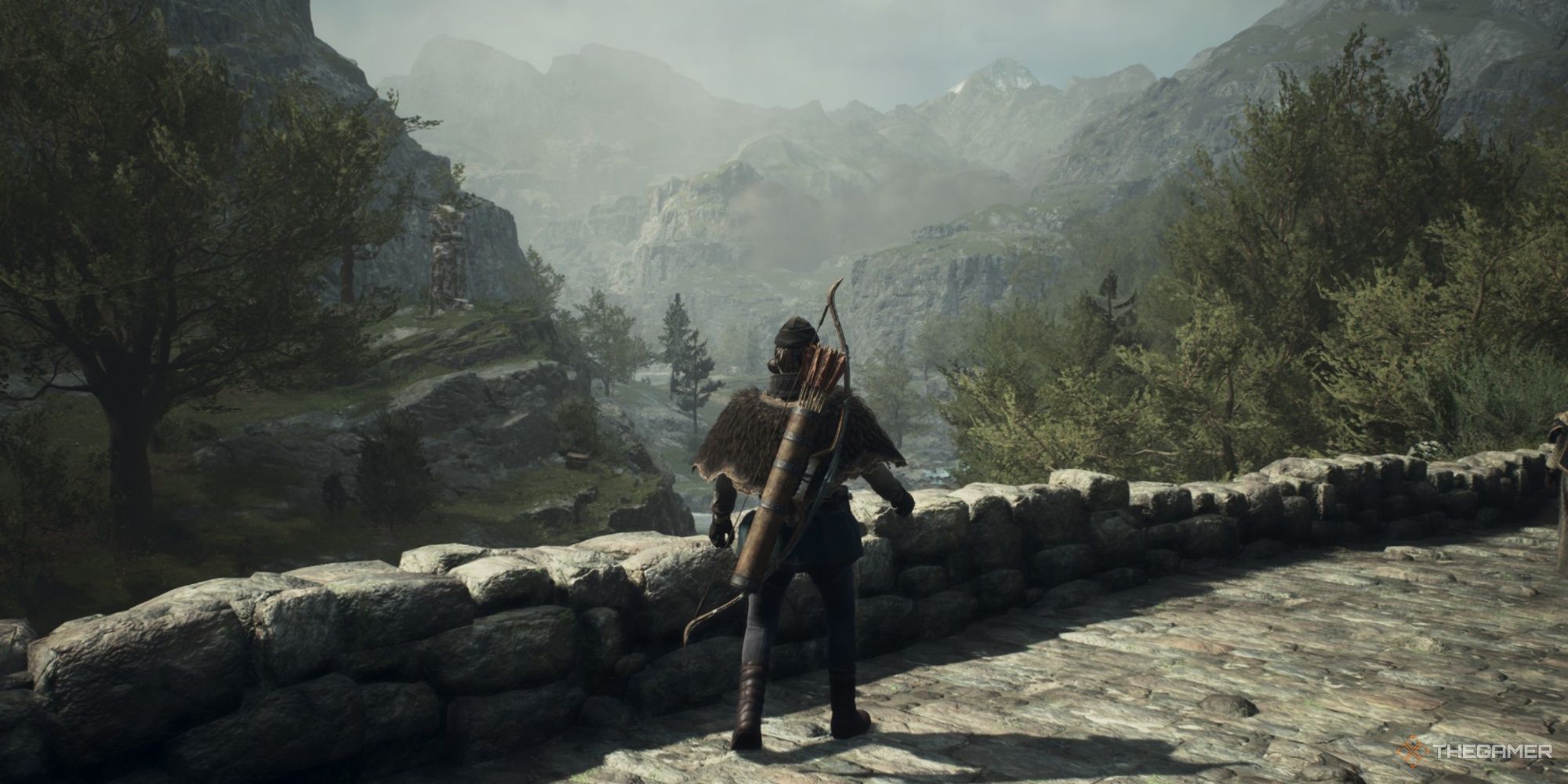 An Archer standing on a bridge looking at the valley below in Dragon's Dogma 2