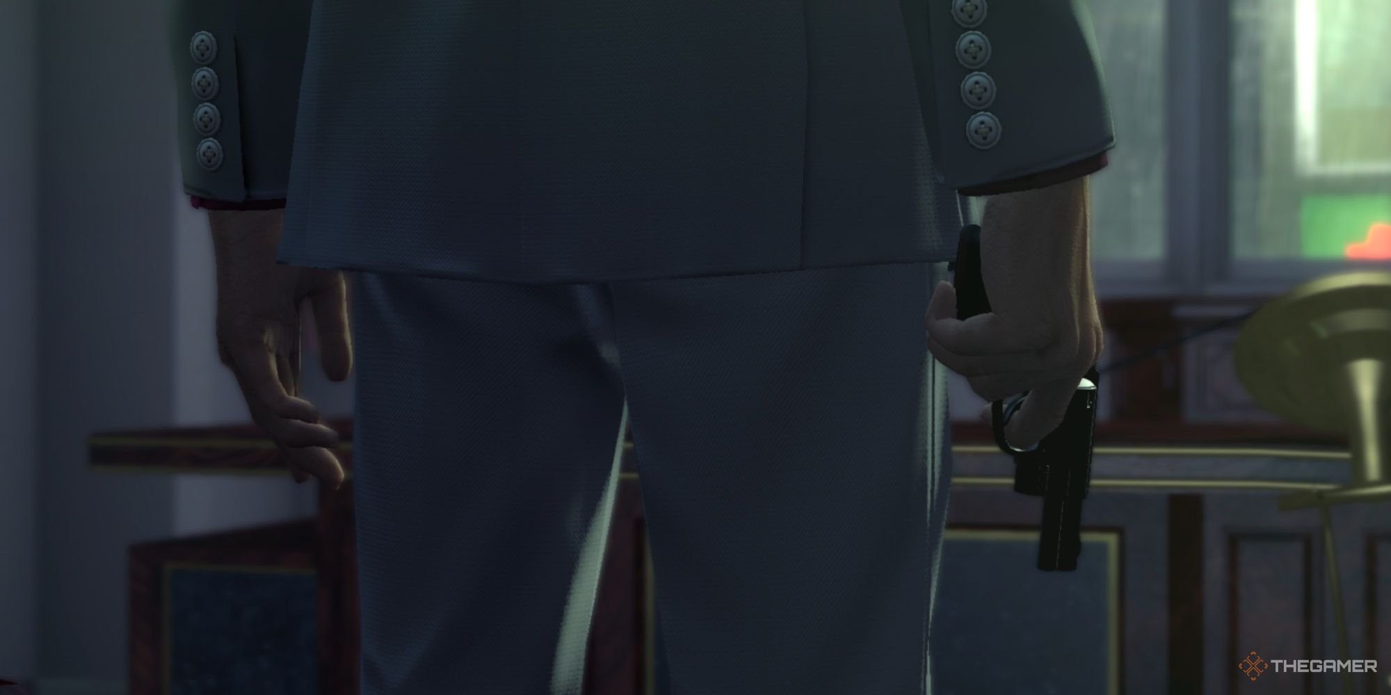 kiryu holding a gun in yakuza kiwami