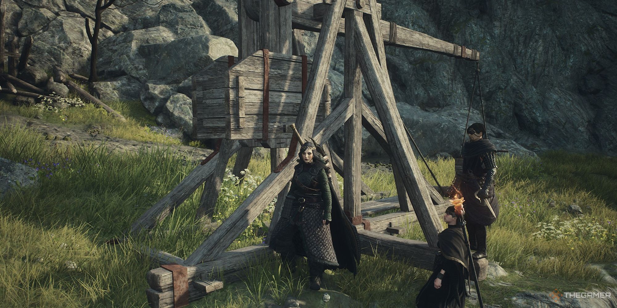 The Arisen and their pawns beside the catapult in Dragon's Dogma 2.