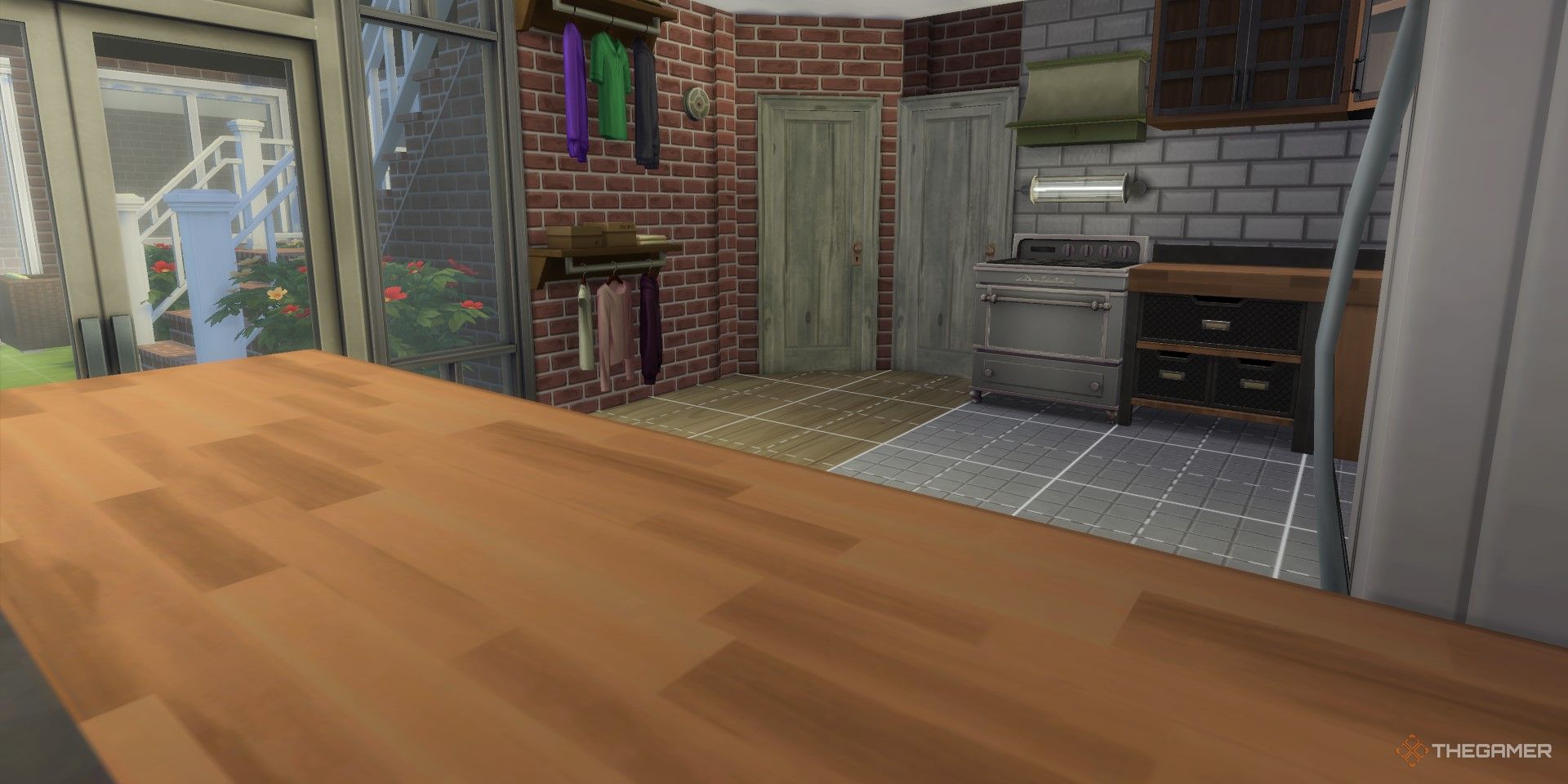 Kitchen with an industrial aesthetic with large windows leading to a small underground patio.