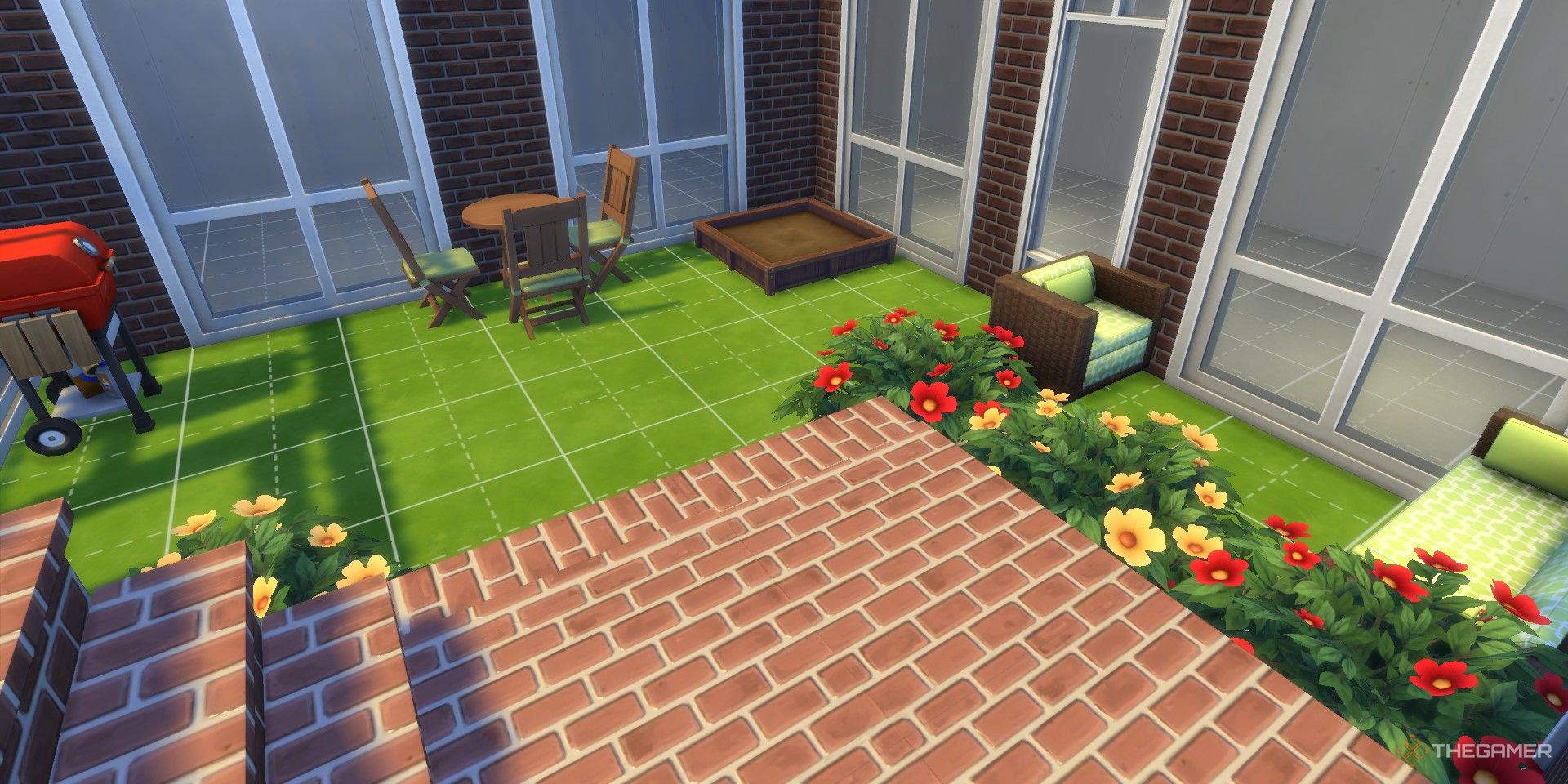 Brick stairs lead down into a small outdoor patio space.