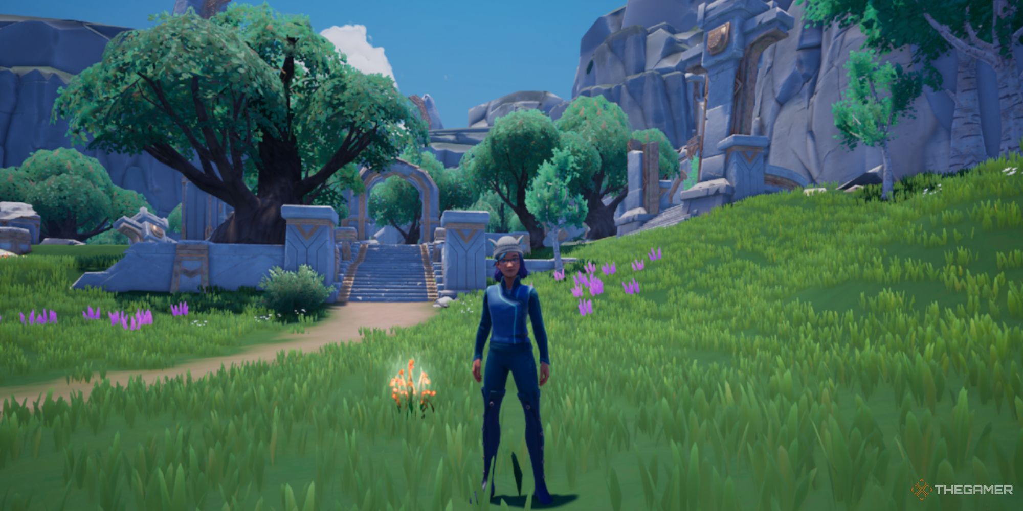 Palia avatar standing next to Spice Sprouts. The ruins at Mirror Pond are visible in the background.