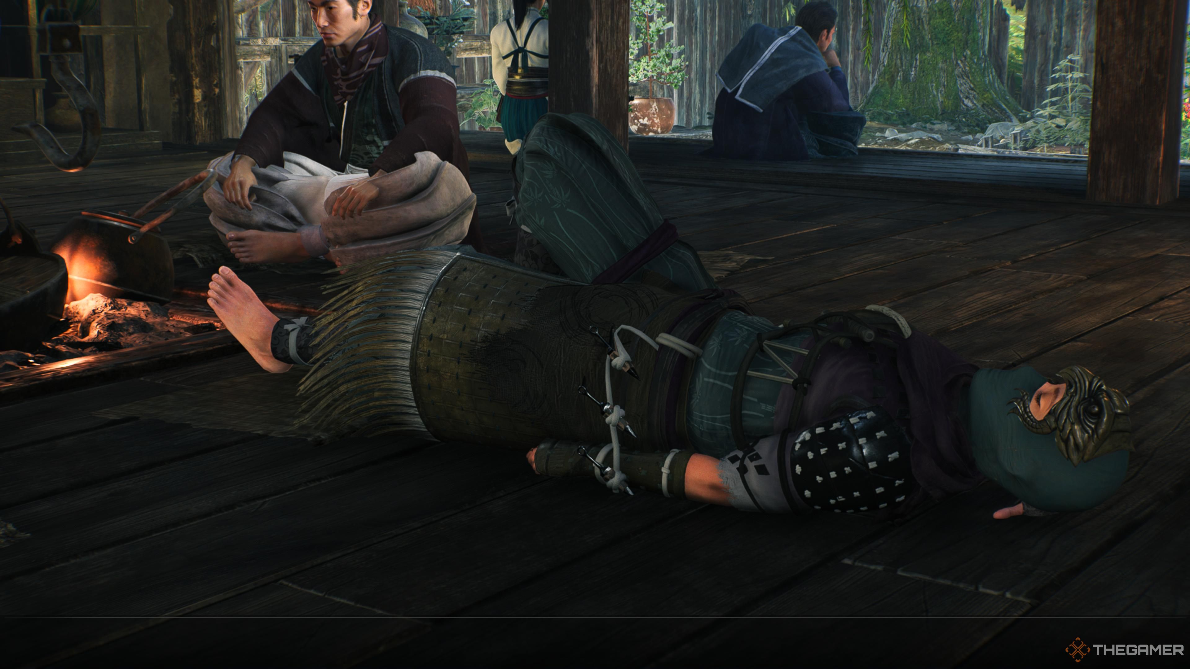 Resting in a longhouse in Rise of the Ronin
