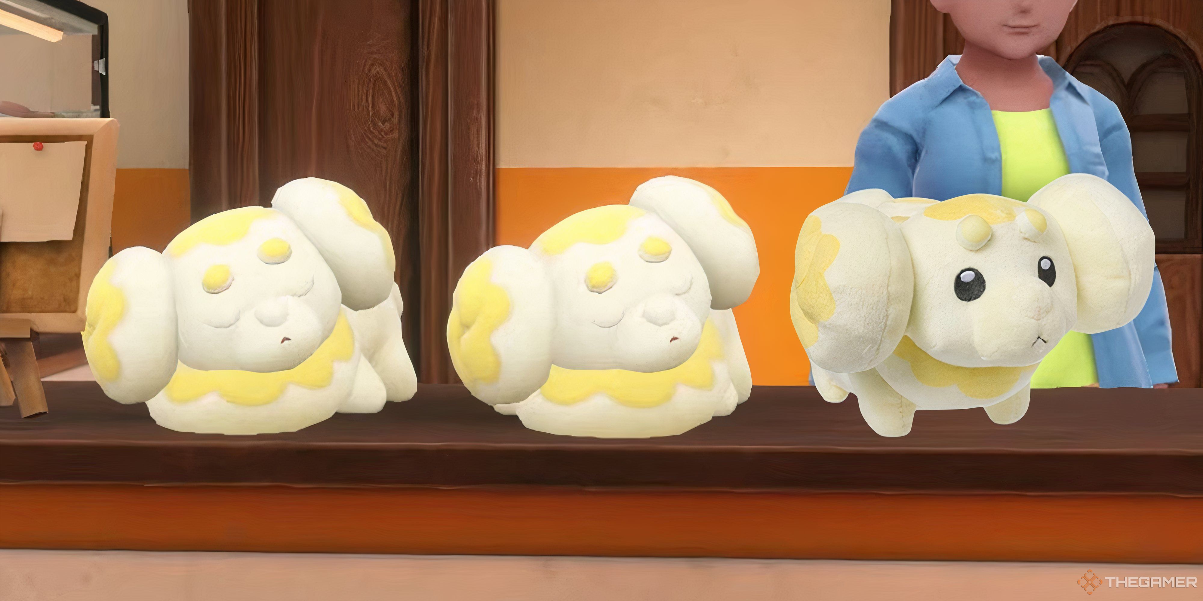 pokemon fidough plush next to two sleeping fidough in scarlet and violet