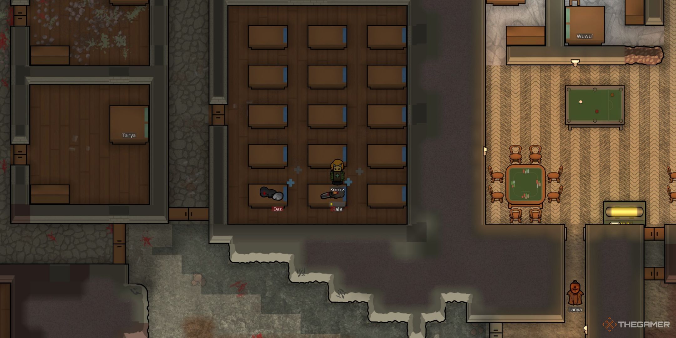 Rimworld Un colono che cura un colono ferito mentre un altro giace in un letto d'ospedale