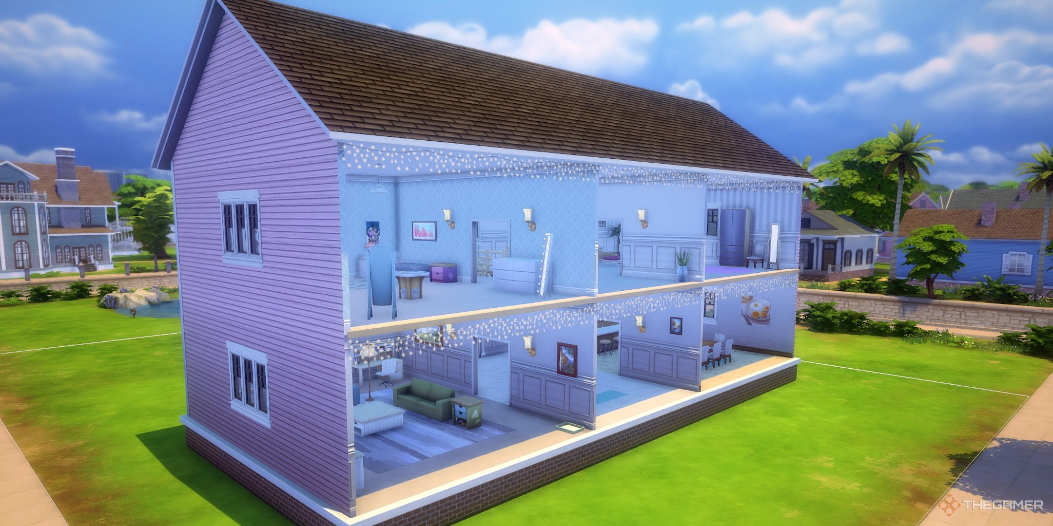 A pink dollhouse built in The Sims 4