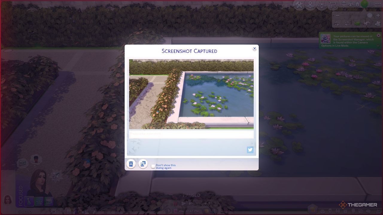 A screenshot of a fountain is a captured in Sims 4