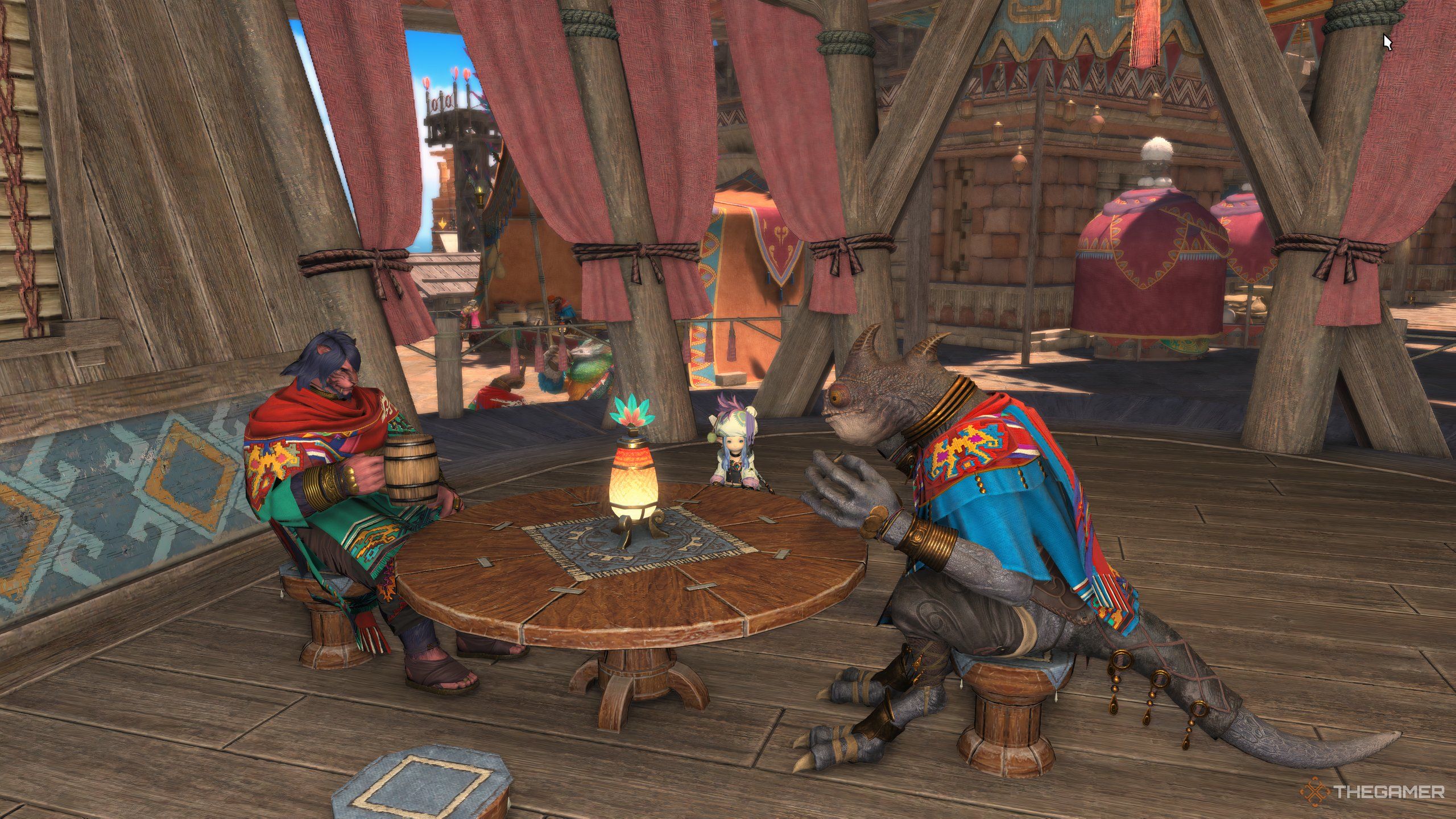 A Llafell sitting with NPCs in Tuliyollal in Final Fantasy 14's Dawntrail.