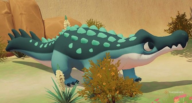Close up view of a Sarcosuchus of varying green shades in Ariacotta Dunes in Paleo Pines.
