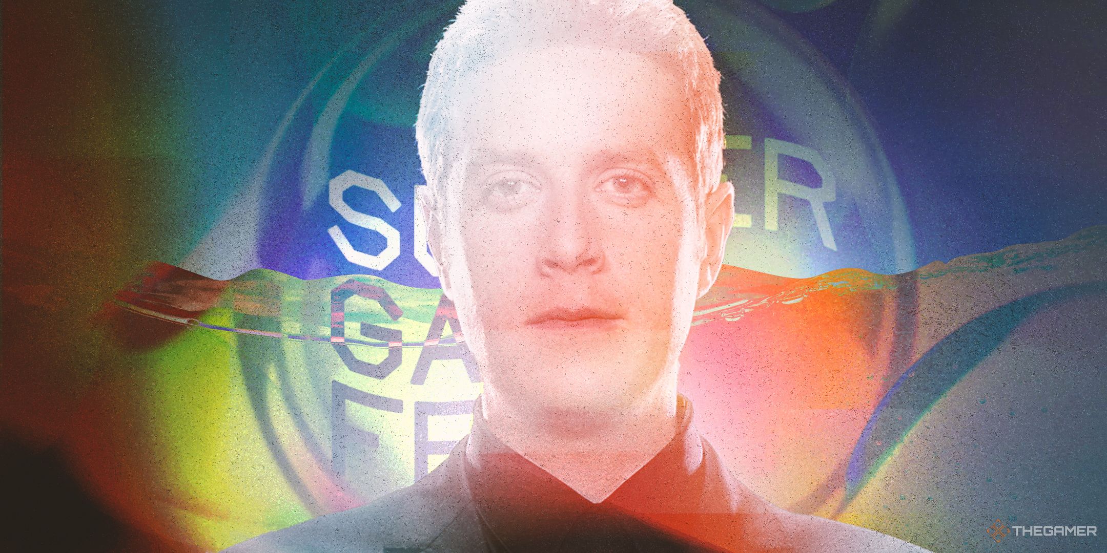 Geoff Keighley in front of the Summer Game Fest poster 