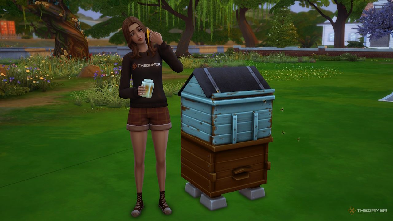 A Sim eats honey collected from her bee box.