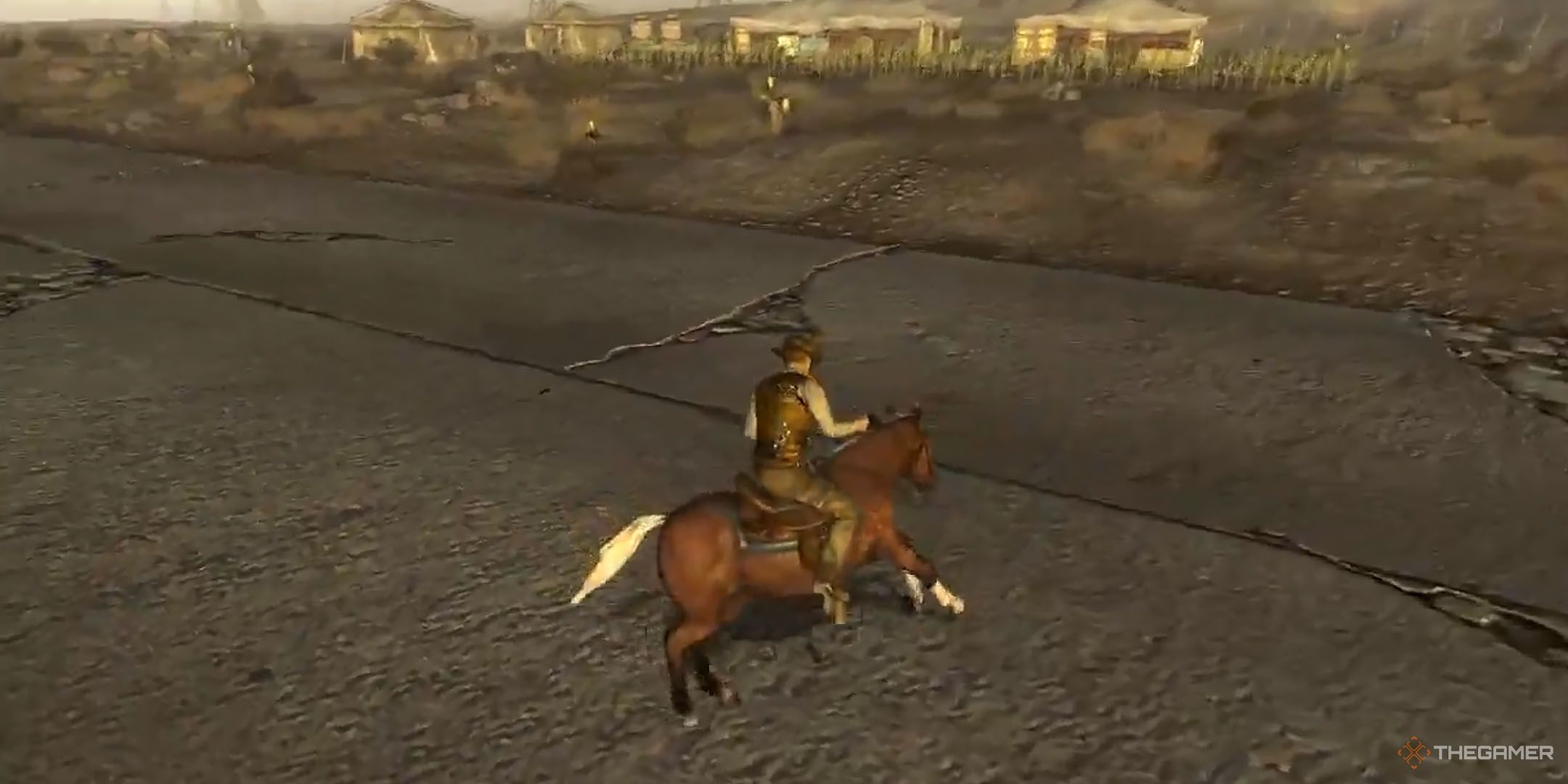 Fallout: New Vegas player in a cowboy outfit riding a brown horse on the main road 